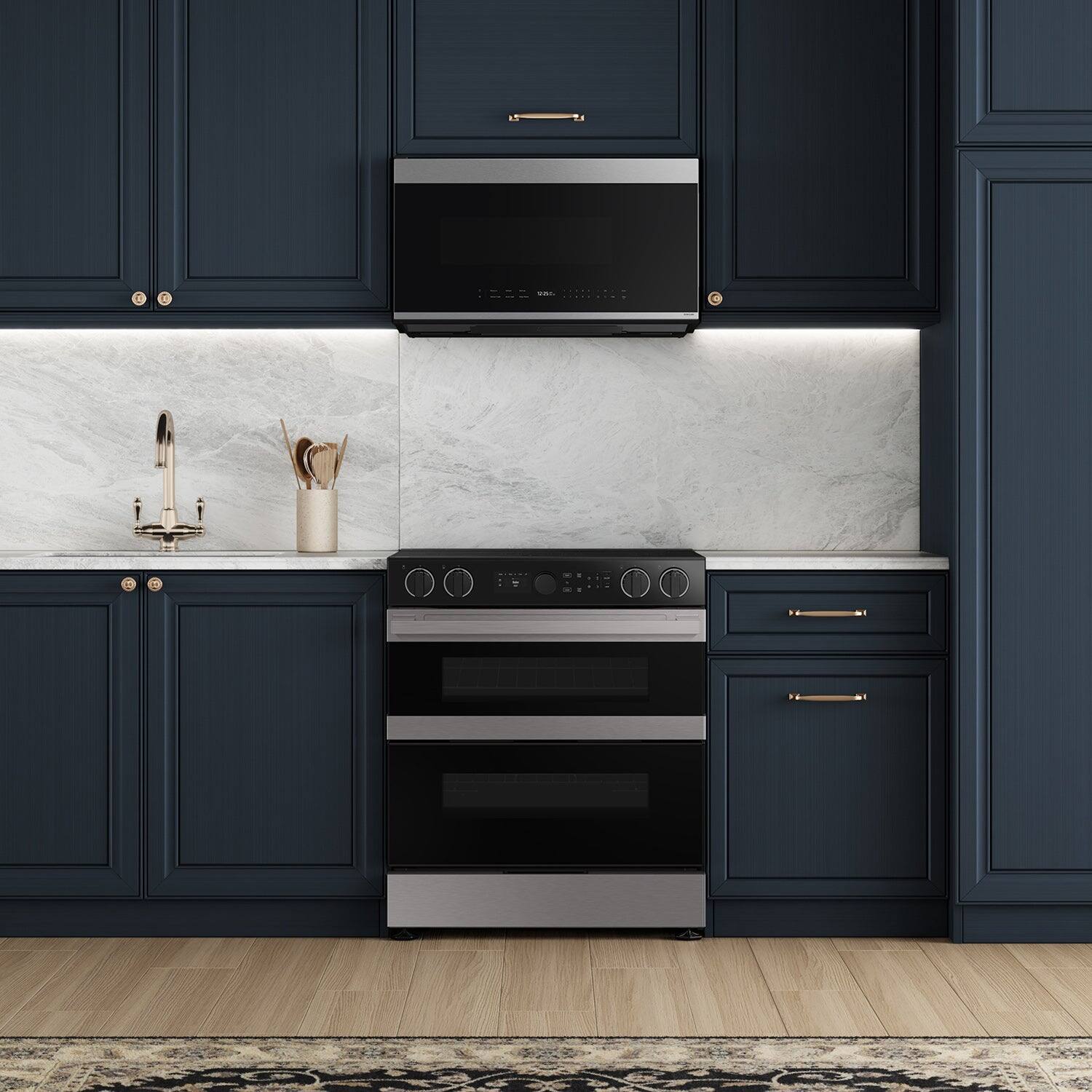 The image features a kitchen with a stove top oven and a microwave above it. The oven is positioned in the middle of the kitchen, while the microwave is placed above it. The kitchen also has a sink and a countertop, which complements the overall design. The combination of the stove, microwave, and sink creates a functional and efficient space for cooking and food preparation.