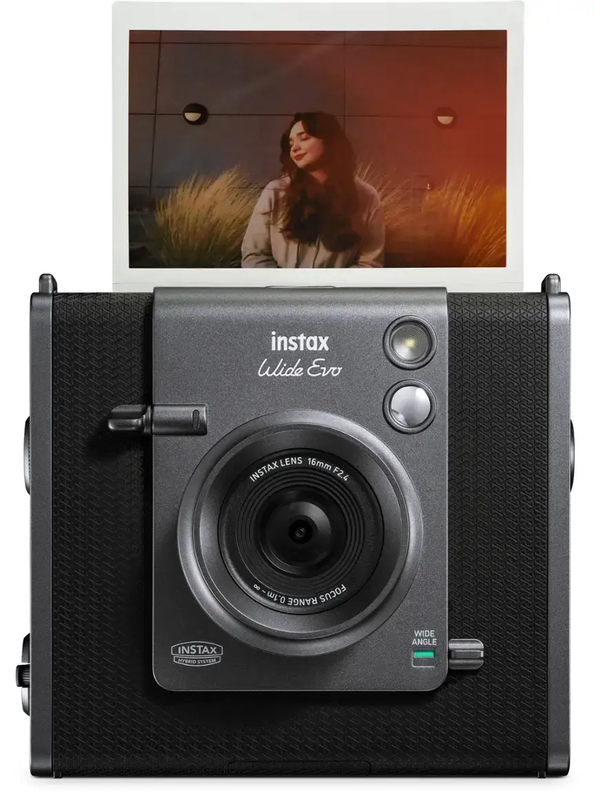 The image features a black Instax Wide Evo camera with a lens that offers a wide-angle view. The camera is designed for use with Instax film, and it has a focus range of 0.1 meters to 1 meter. The lens has a focal length of 16mm, which allows for a broader field of view. The camera is a part of the Instax MyBridge system, which enables users to connect their Instax cameras to their smartphones for additional features and functionality.