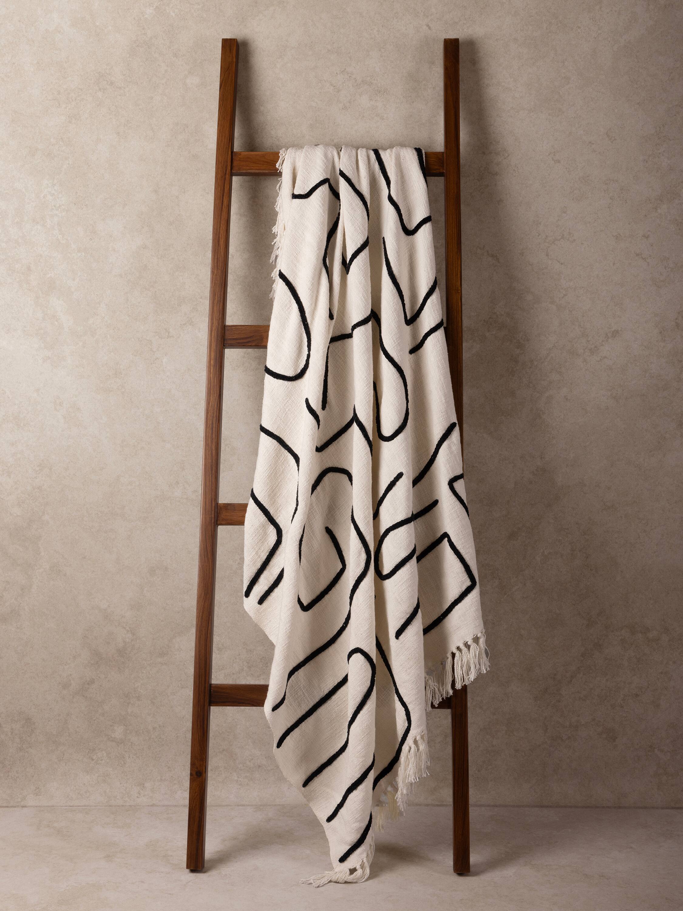 Angle. GAURI KOHLI - Slovenia Throw Blanket - Shades of ivory and black.