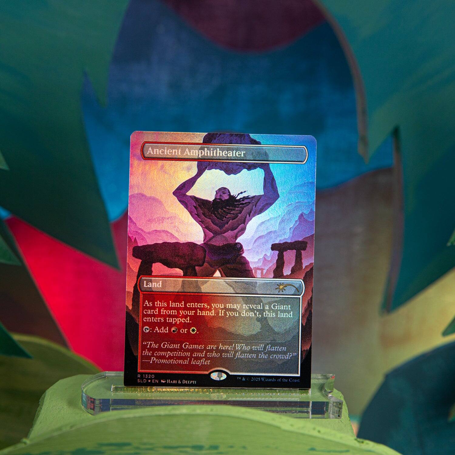 Ancient Amphitheater  
Land  

As this land enters, you may reveal a Giant card from your hand. If you don't, this land enters tapped.  
Q: Add or O.  

"The Giant Games are here! Who will flatten the competition and who will flatten the crowd?"  
- Promotional leaflet  

d 1320  
SLD EN  
HARI & DEEPTI  
© 2025 Wizards of the Coast