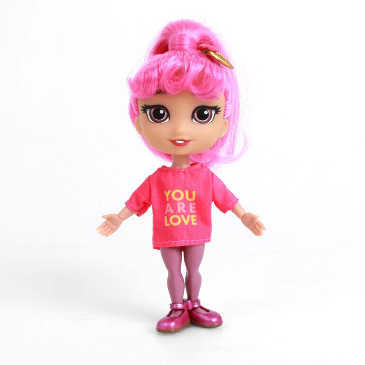 The text on the doll's shirt reads: "YOU ARE LOVE."