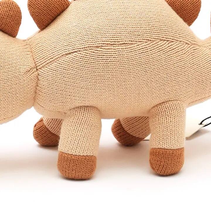 Angle. Siljoy - Knitted Dinosaur Soft Toy, 35x13cm, Peach Powder, 100% Cotton & Polyester, Unique Spots & Spikes - Peach.