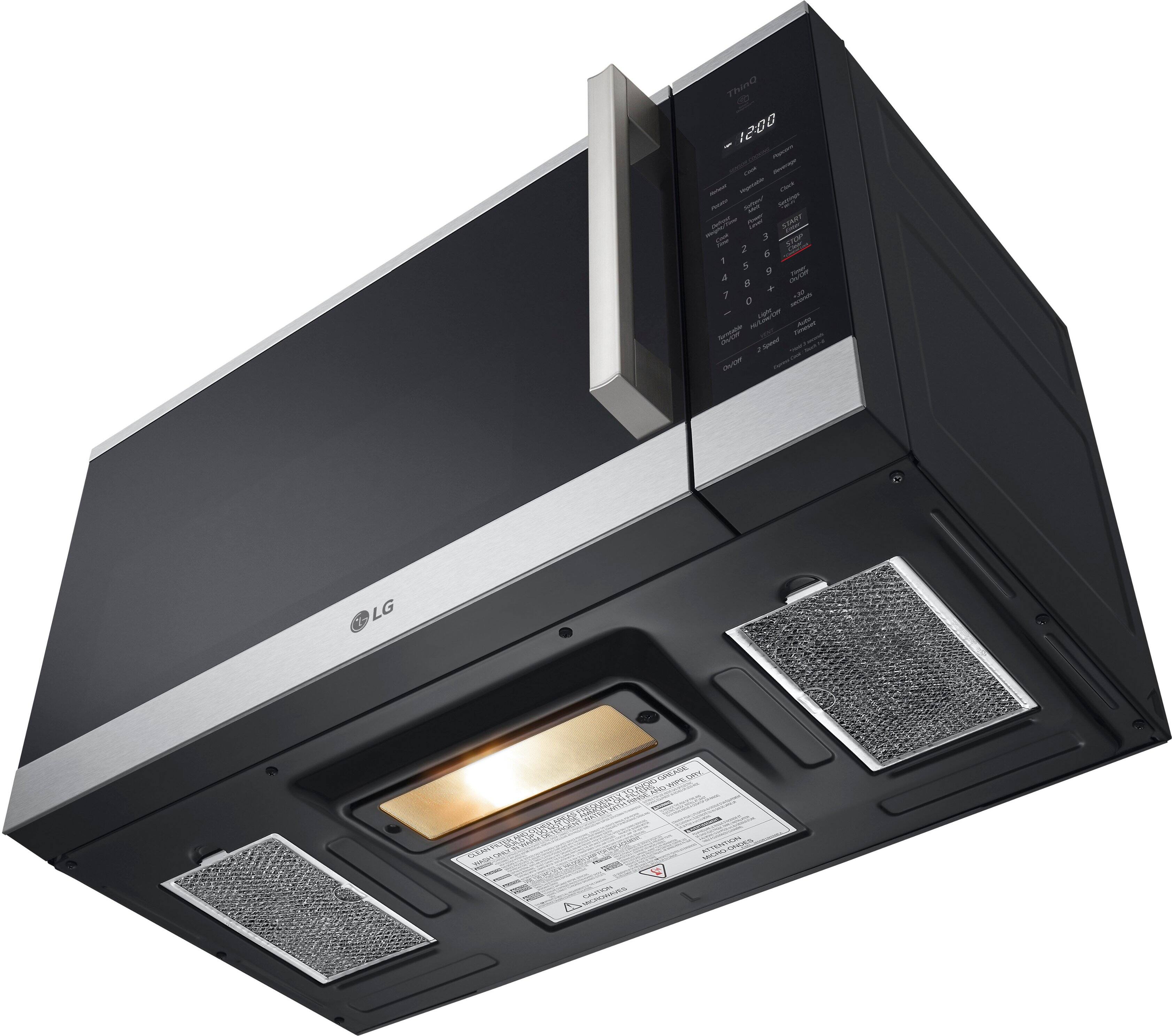 The image features a black LG microwave oven with a silver door. The microwave has a digital display and a silver handle. The oven is designed to be built into a wall, and it has a stainless steel finish. The microwave is equipped with a toaster oven, making it a versatile appliance for cooking and heating food. The oven is likely a part of a larger kitchen setup, providing convenience and functionality for the user.