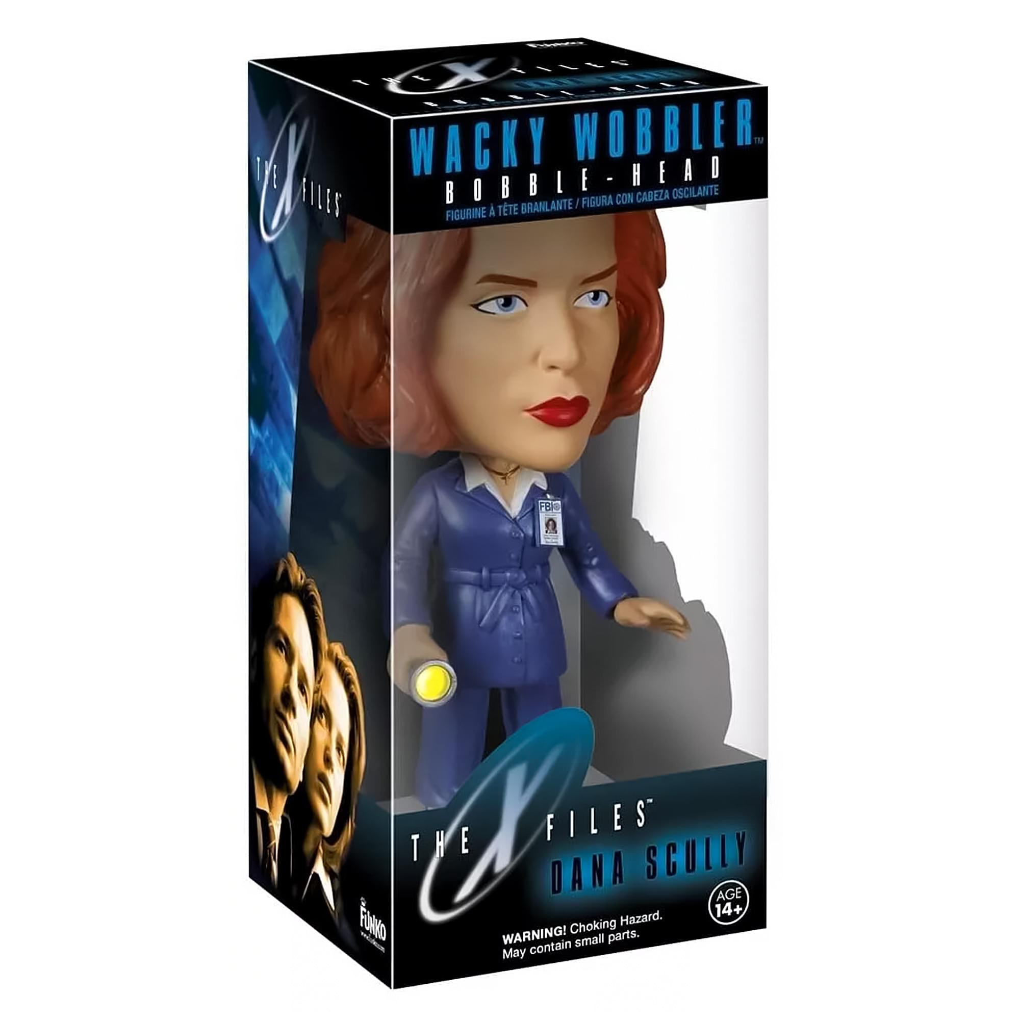The text on the image is:

"WACKY WOBBLER
BOBBLE-HEAD
FIGURINE À TÊTE OSCILLANTE / FIGURA CON CABEZA OSCILANTE

THE X FILES
DANA SCULLY

AGE 14+
WARNING! Choking Hazard. May contain small parts."