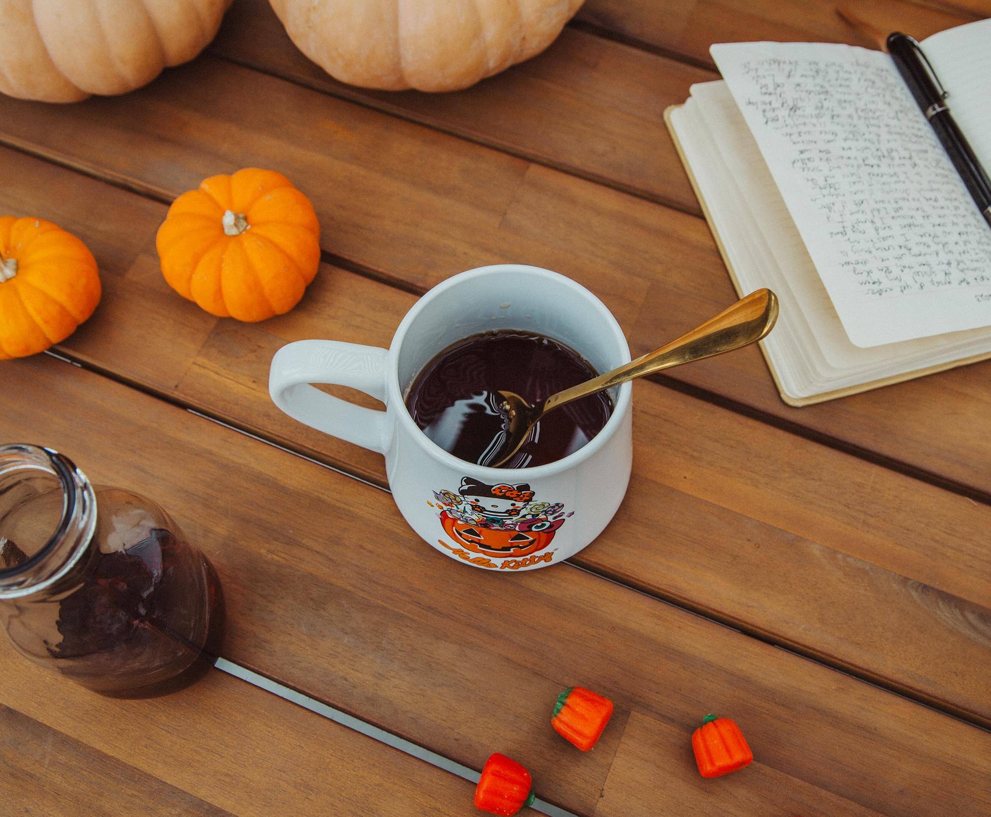 Alt View 3. Silver Buffalo - Sanrio Hello Kitty Pumpkin Candy Burglar Tapered Pottery Mug | Holds 14 Ounces - Orange.