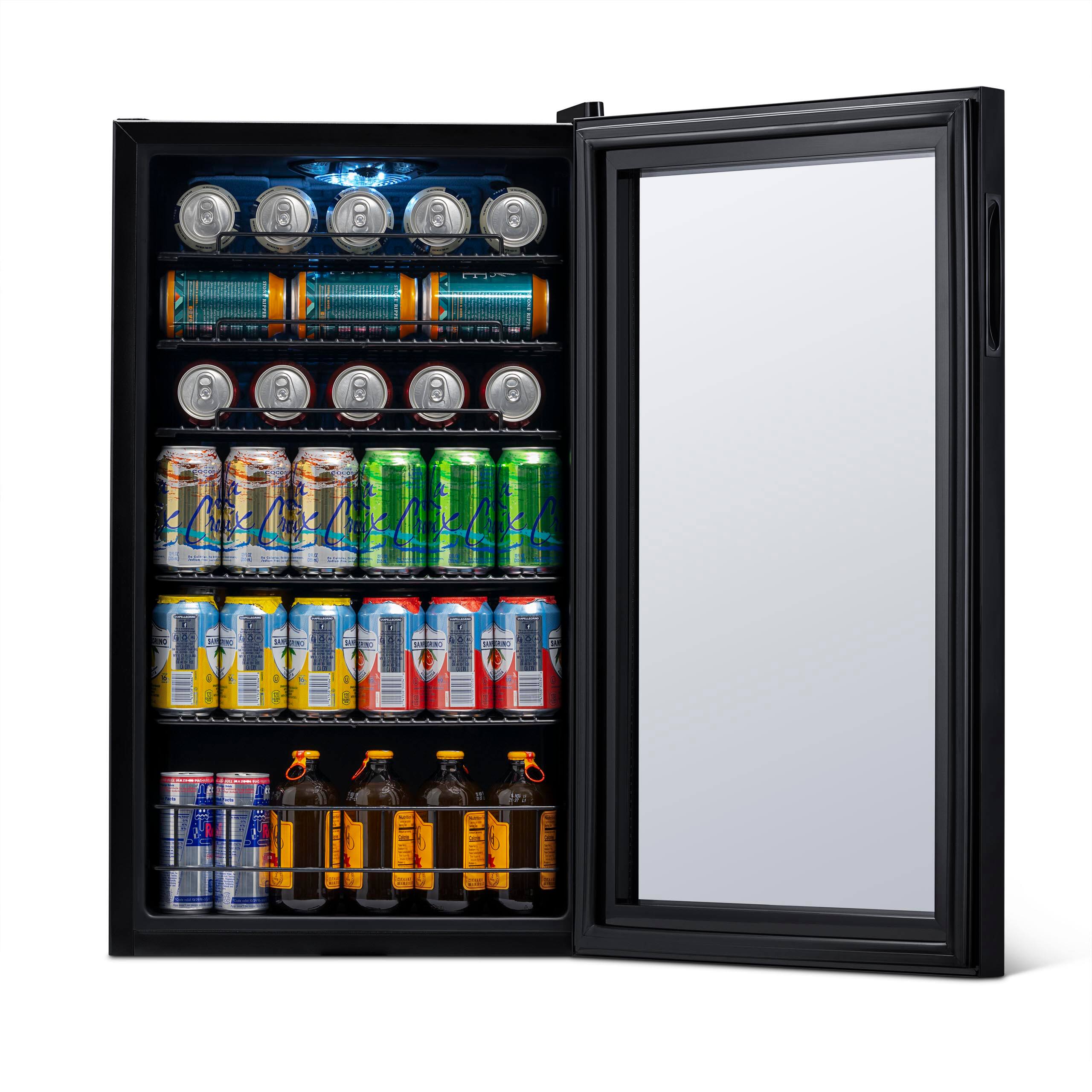 The image shows a refrigerator with a variety of drinks inside. There are several cans of soda, including Mountain Dew, and a few bottles of beer. The refrigerator is filled with a wide assortment of drinks, making it a convenient place to store and access beverages.