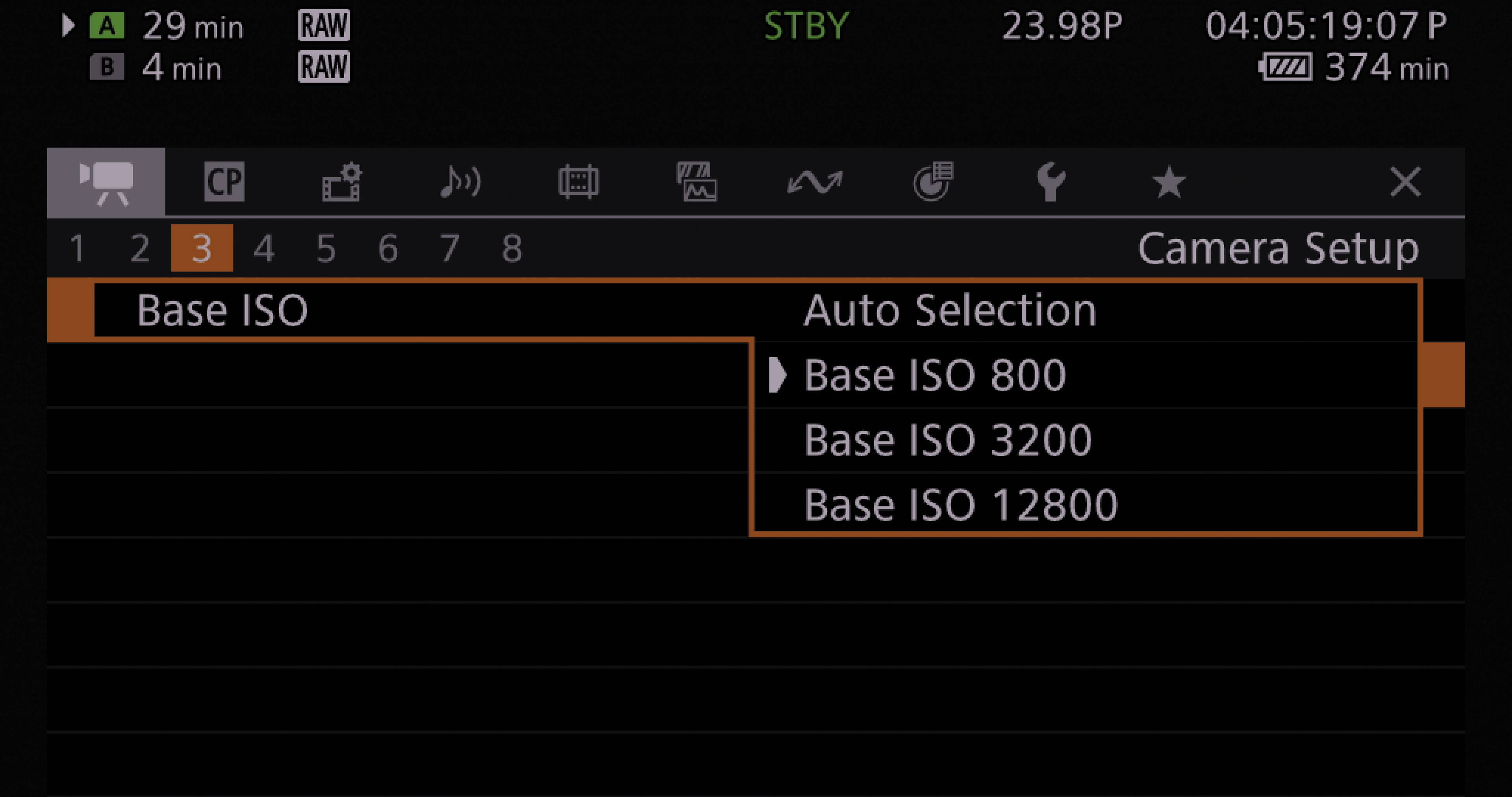 The image shows a screen with various settings for a camera. The settings include Base ISO, Auto Selection, and Camera Setup. The Base ISO options are 800, 3200, and 12800. The Auto Selection option is set to 23.98P, and the time displayed is 04:05:19:07P. The Camera Setup menu is open, and the image is taken at 374 minutes past 1.