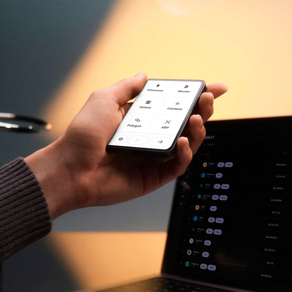 The text on the image is a list of cryptocurrencies, which can be grouped and corrected as follows:
1. Ethereum
2. Bitcoin
3. Solana
4. Cardano
5. Polygon
6. XRP
7. Ark
8. Seeoh
9. 8102001
10. 8272
11. 8372
12. 8472
13. 8572
14. 8672
15. 8772
16. 8872
17. 8972
18. 9072
19. 9172
20. 9272
21. 9372
22. 9472
23. 9572
24. 9672
25. 9772
26. 9872
27. 9972
This list of cryptocurrencies is displayed on a cell phone screen, and the person holding the phone is likely checking the prices or information related to these digital currencies.