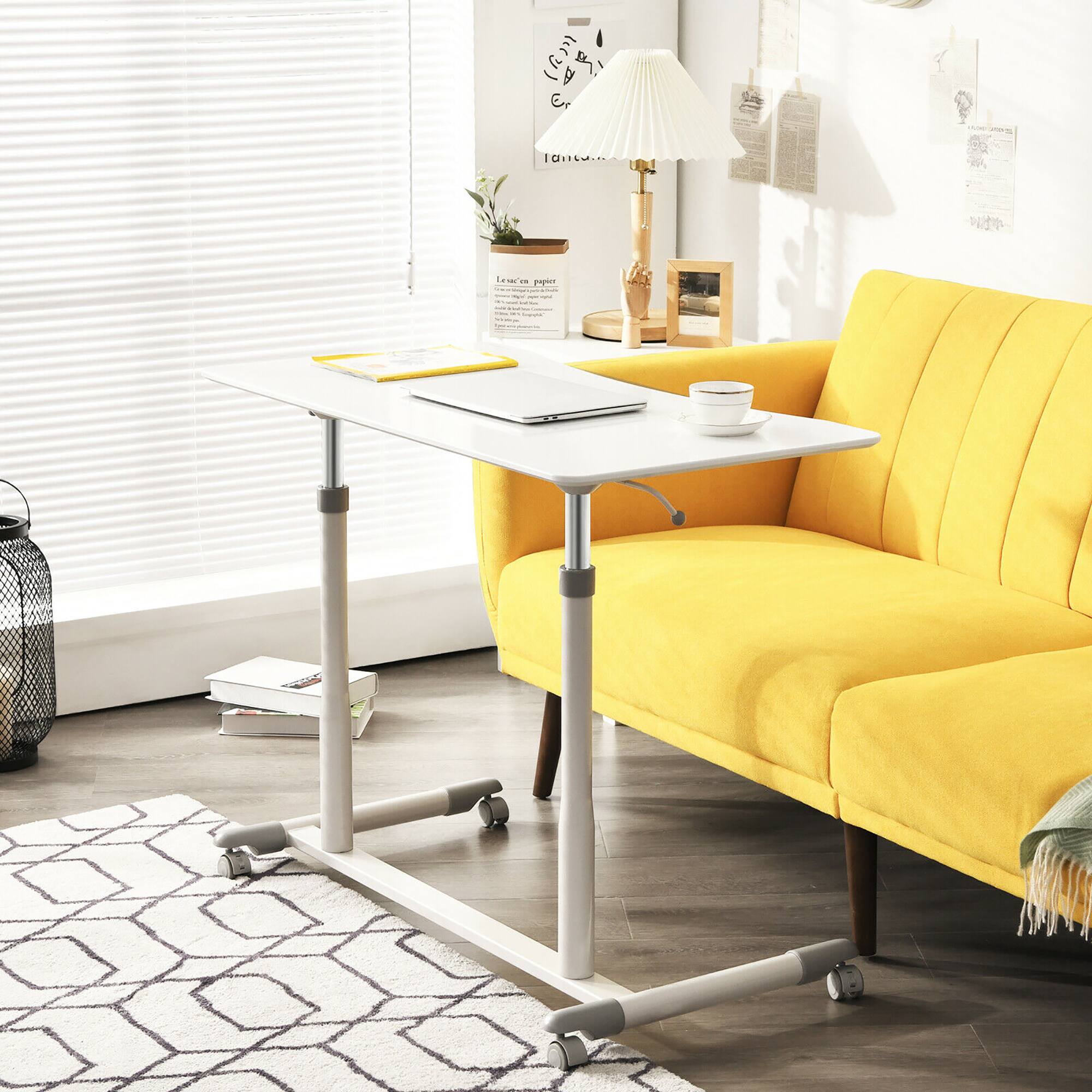 Sure, here is the corrected and grouped text from the image:

1. On the wall:
   - "Laissez-nous papoter"
   - "Laissez-nous papoter"

2. On the lampshade:
   - "E"

3. On the wall art:
   - "Happiness is a warm blanket"

4. On the calendar:
   - "2023"

5. On the framed picture:
   - "Happiness is a warm blanket"

6. On the wall:
   - "Happiness is a warm blanket"