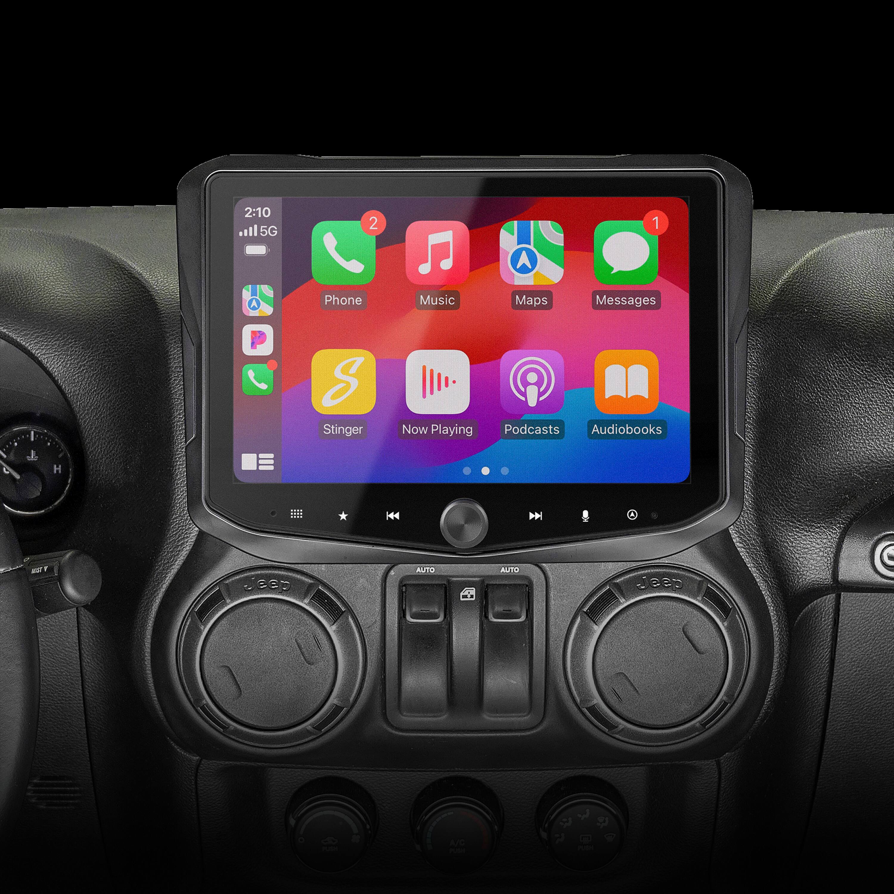 The image shows a car dashboard with a large touch screen display. The screen is displaying various icons, including a phone, music, maps, and messages. There are also icons for podcasts and audiobooks. The car's dashboard is equipped with a steering wheel and a control panel. The display is brightly lit, making it easy to read and navigate the various options available on the screen.