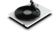 The image features a record player with a record on it. The record is placed on a turntable, and the needle is positioned over the record. The record player is sitting on a white surface, and the record itself is black. The scene is a close-up view of the record player and record, showcasing the details of the equipment and the record.