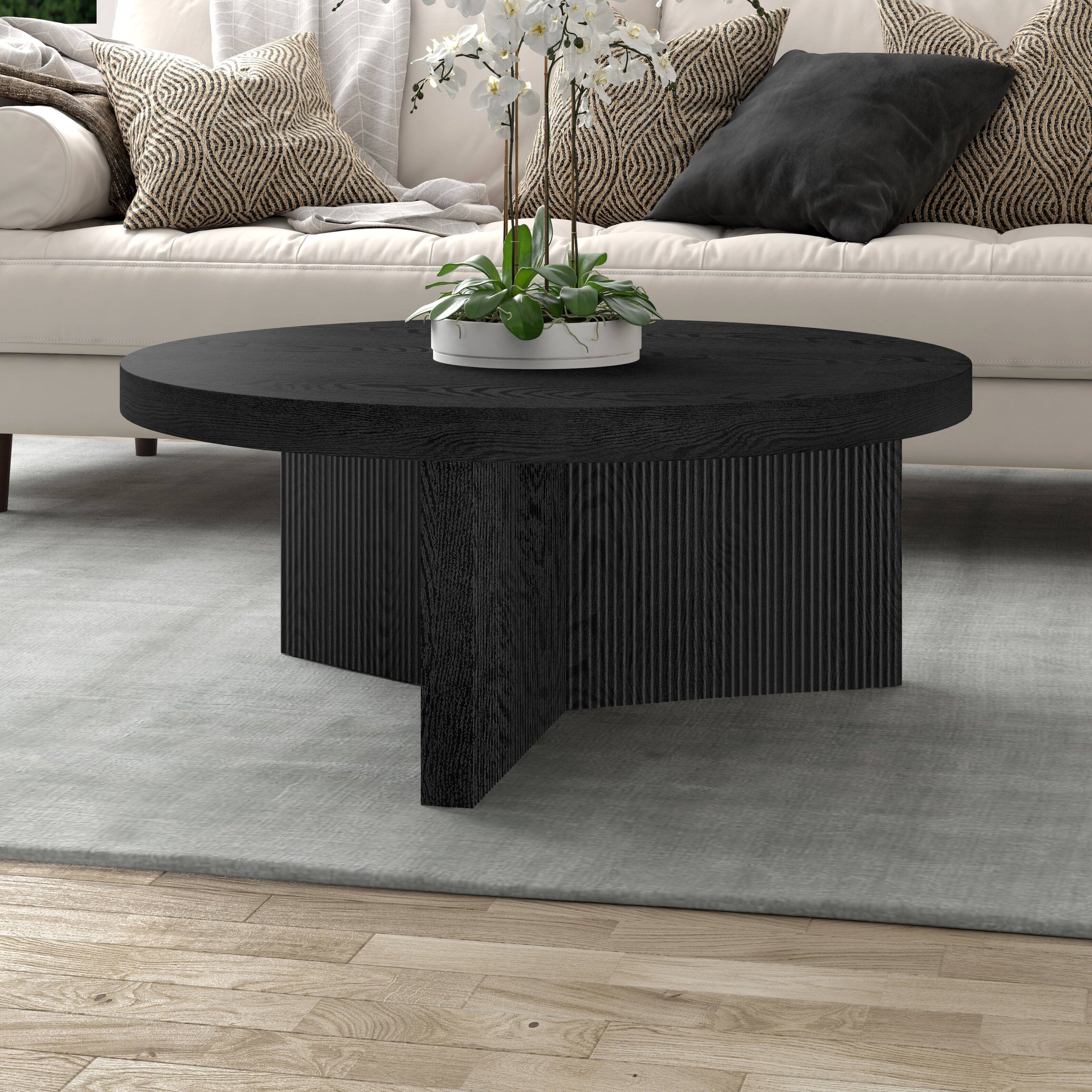 Left. Hudson&Canal - Holm 36" Wide Round Fluted Coffee Table - Black.