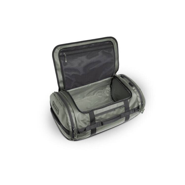 Angle. WANDRD - WANDRD CARRYALL Duffel with Expandable Bottom Compartment (Wasatch Green, 60L) - Green.