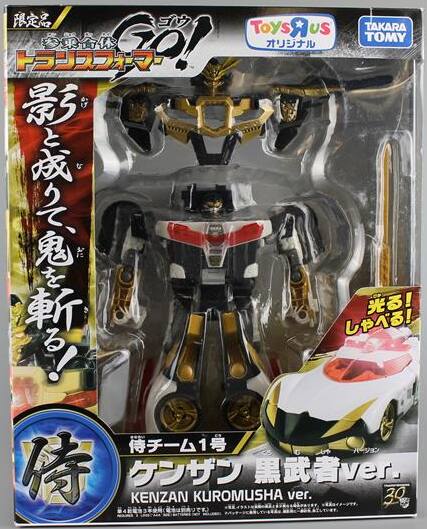 Sure, here is the corrected and grouped text from the image:

---

**Toys "us"**  
**TAKARA TOMY**

**限定品**  
**参乗合体**  
**ゴジラ**  
**ゴジラ**  
**影と城を鬼を斬る!**

**侍チーム1号**  
**ケンザン 黒武者 ver.**  
**KENZAN KUROMUSHA ver.**

**光る!**  
**しゃべる!**

**30**

---

This text is from the packaging of a Godzilla toy, specifically the "Kenzan Kuromusha" version.