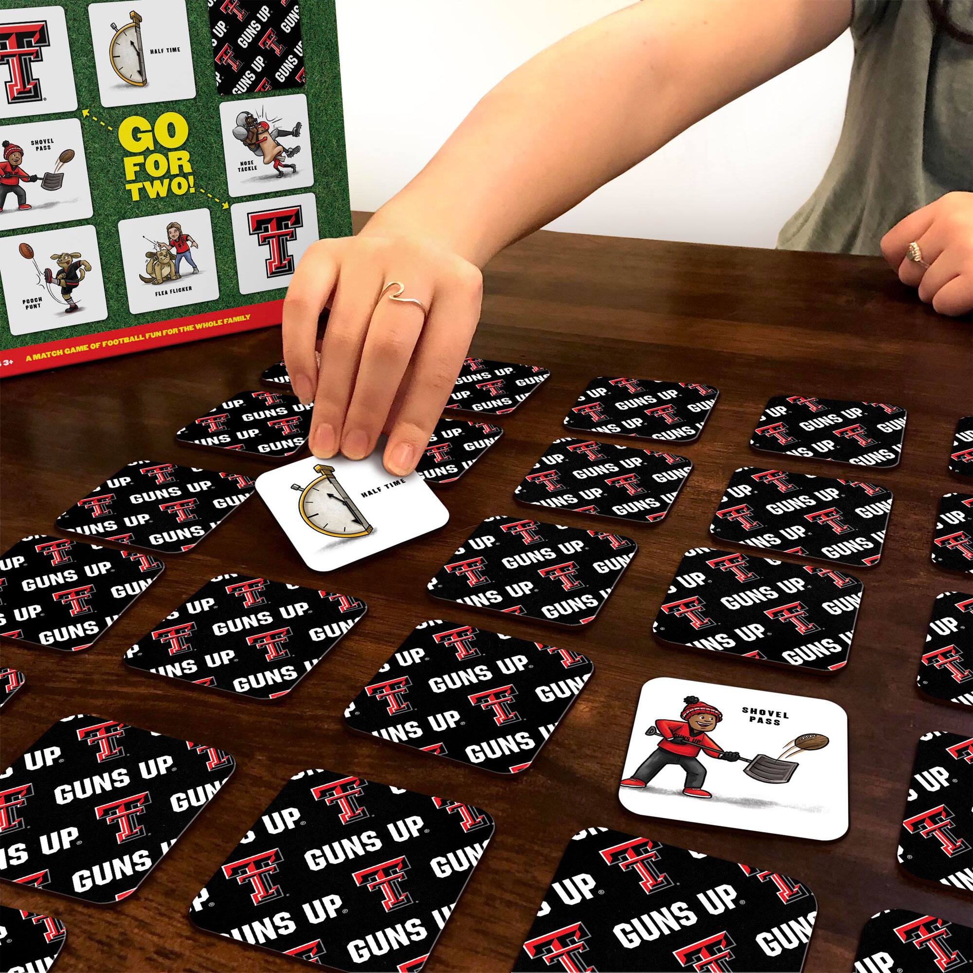 Sure, here is the corrected and grouped text from the image:

**Main Text:**
- GUNS UP
- INS UP

**Card Text:**
1. GO FOR TWO!
2. HALFTIME
3. SHOVEL PASS
4. POOR FONT
5. TATTLE TALE
6. TATTLE TALE
7. FILE FUMBLE
8. A MATCH GAME OF FOOTBALL FOR THE WHOLE FAMILY

**Additional Text:**
- "GUNS UP" repeated multiple times on the cards.