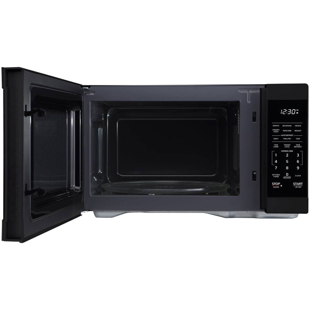 The image features a black microwave oven with a digital display showing the time of 12:30. The microwave is open, revealing its interior.