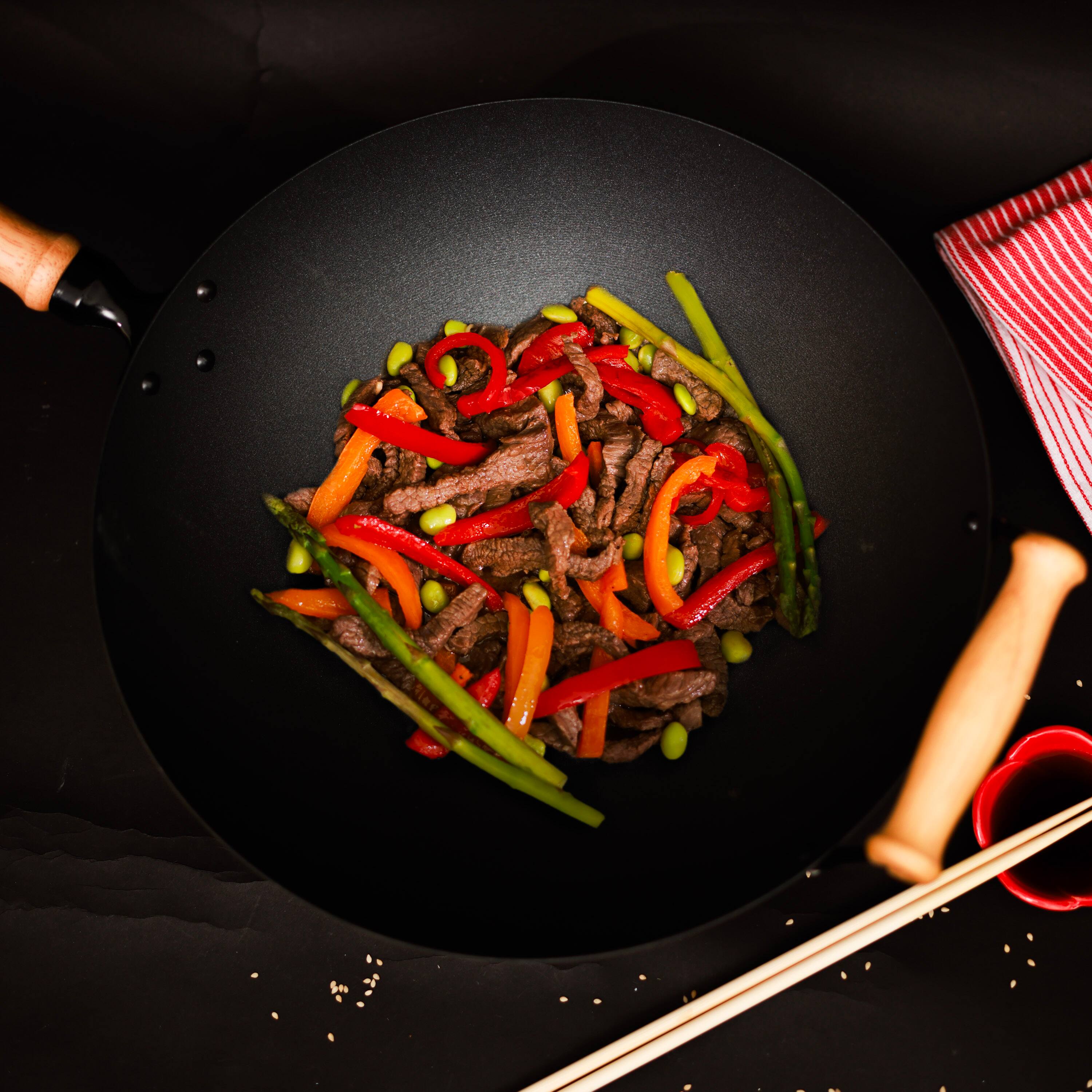 Left. Joyce Chen - Professional Series 14-Inch Carbon Steel Ceramic Nonstick Flat Bottom Wok Set with Lid and Maple Handles, 10 Pieces - Black.