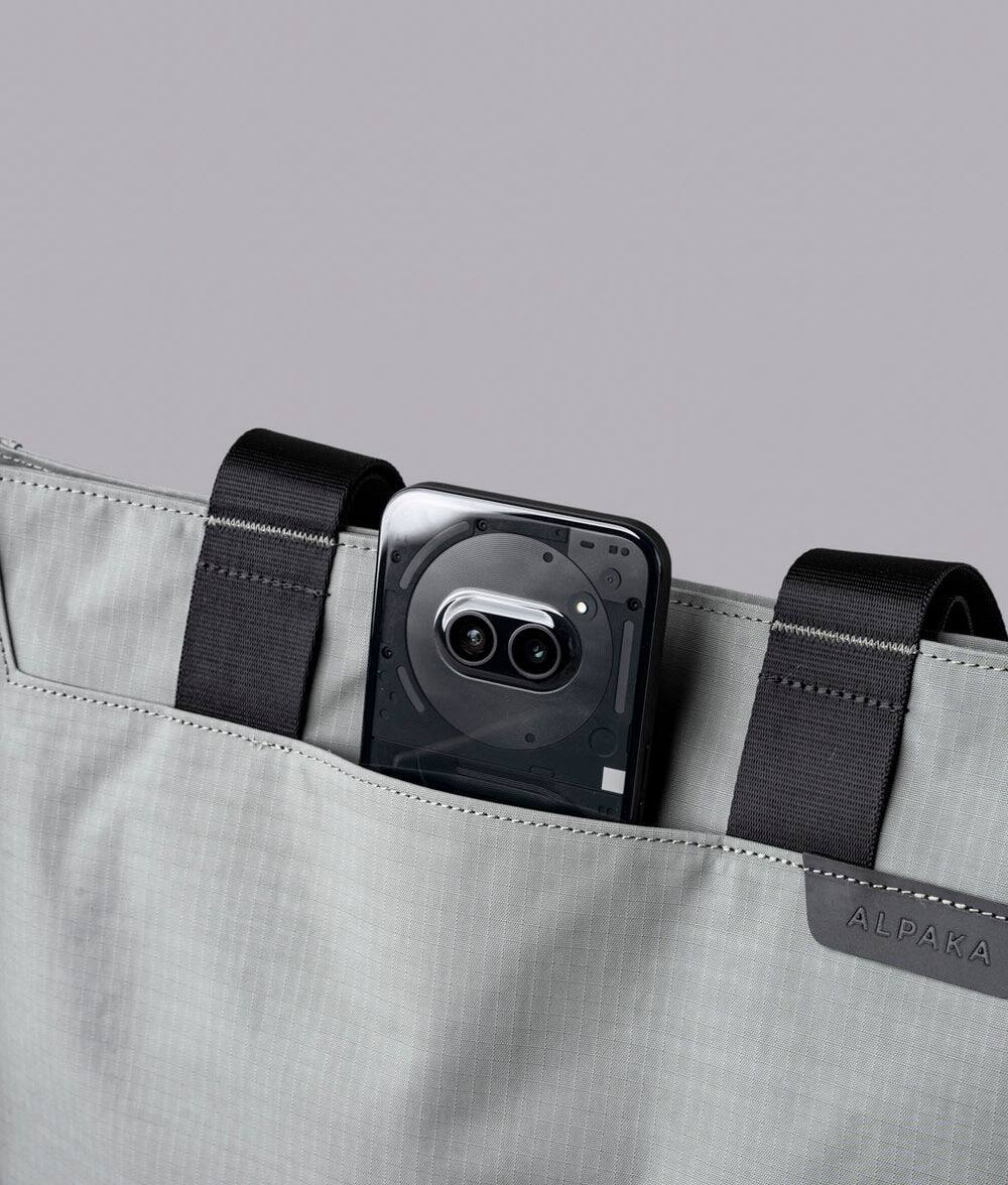 Alt View 5. ALPAKA - Tote Bag Minimalist EDC Travel Tote,14.5L , 2 Bottle Sleeves, Front/Back Slip Pockets, Magnetic Open-Top (No Zipper) - Grey/G Axoflux 210D.