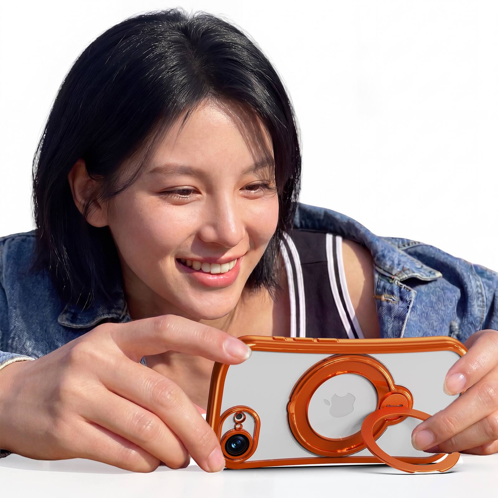 Angle. Dteck - Magnetic Case for Apple iPhone 17e with 360 Ring Stand and Strap, Shockproof TPU Phone Cover Built-in Lens Protector - Orange.