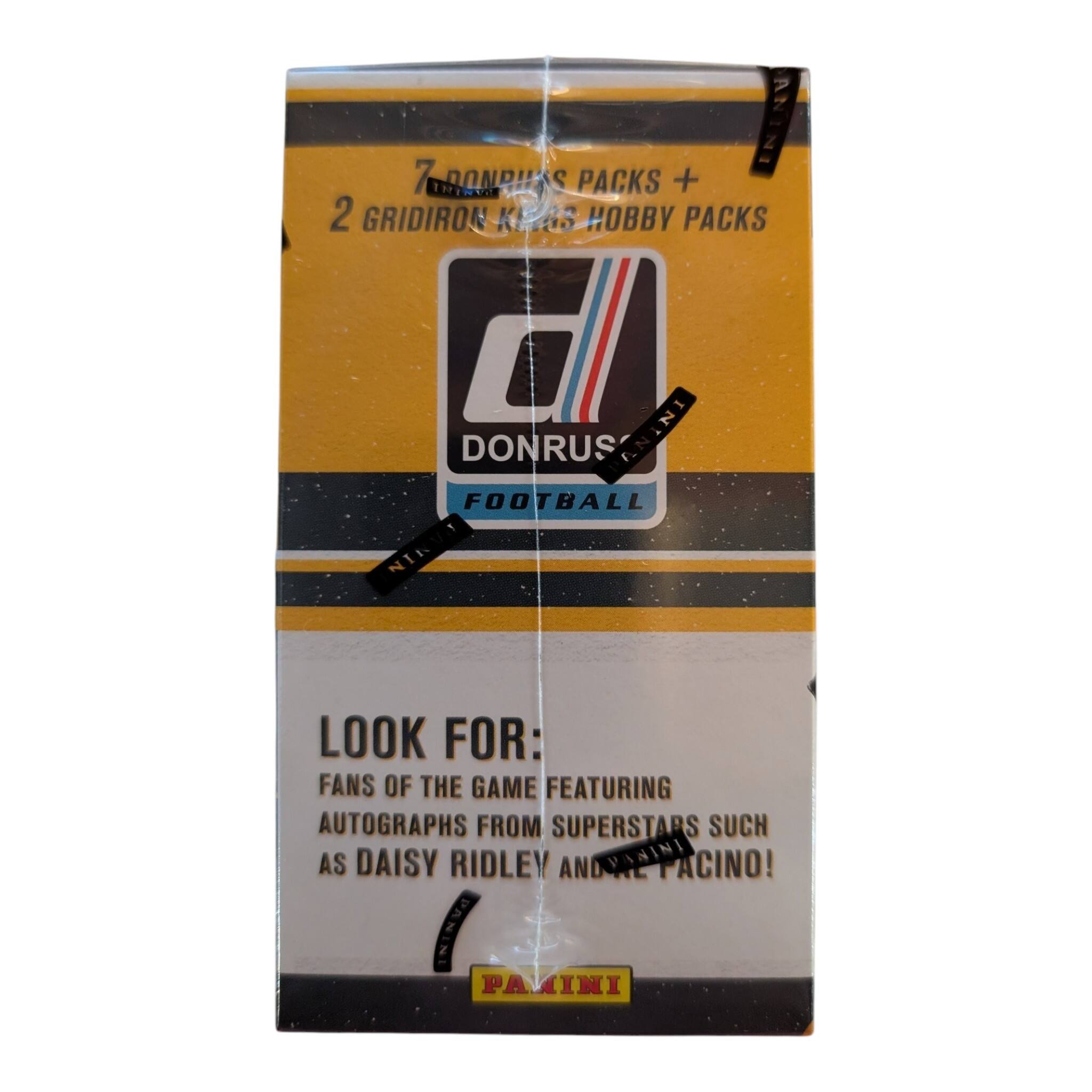 7 DONRUS PACKS + 2 GRIDIRON KINGS HOBBY PACKS  
DONRUS ANINI FOOTBALL  
LOOK FOR: FANS OF THE GAME FEATURING AUTOGRAPHS FROM SUPERSTARS SUCH AS DAISY RIDLEY ANDRIL PACINO!  
PAMINI