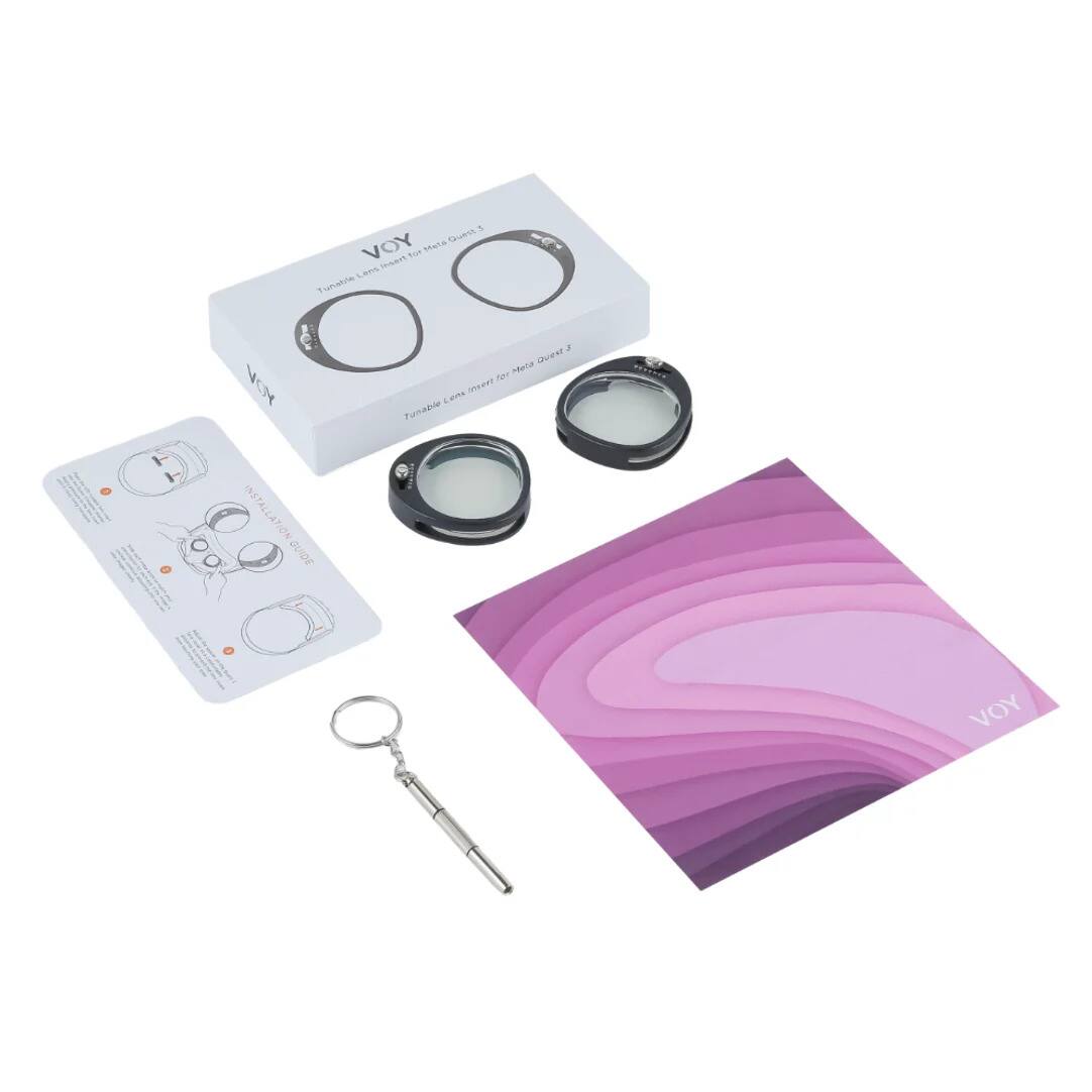 1. VOY
   - Tumble Lens Insert for Magic Quartz
   - Tumble Lens Insert for Meta Quartz

2. Instruction Card
   - Illustrations and text explaining the use of the tumble lenses

3. Keychain

4. Purple and Pink Patterned Cloth
   - With the VOY logo