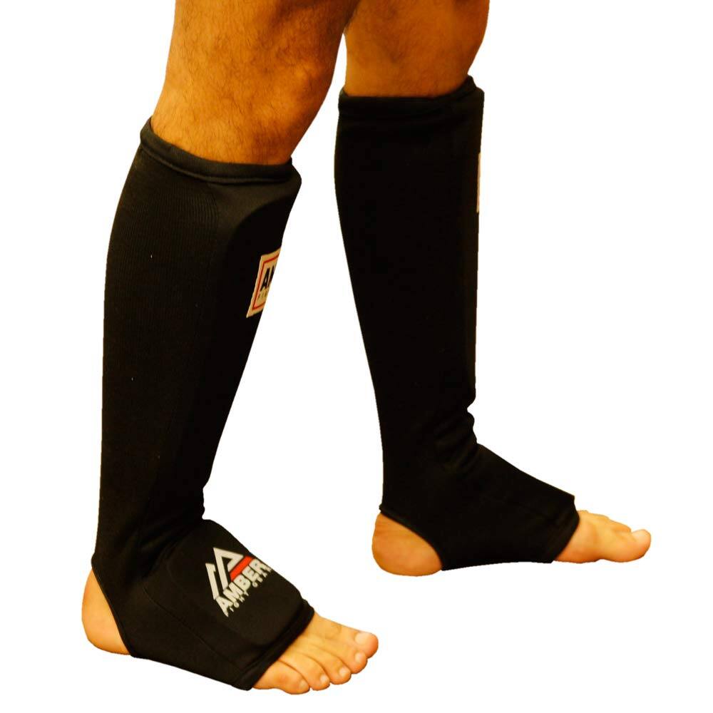 Angle. Amber Sporting Goods - Nylon Shin and Instep Protectors for Muay Thai, Kickboxing, MMA, Thick Padding, Impact Protection, Pair of Shin Guards - Black.