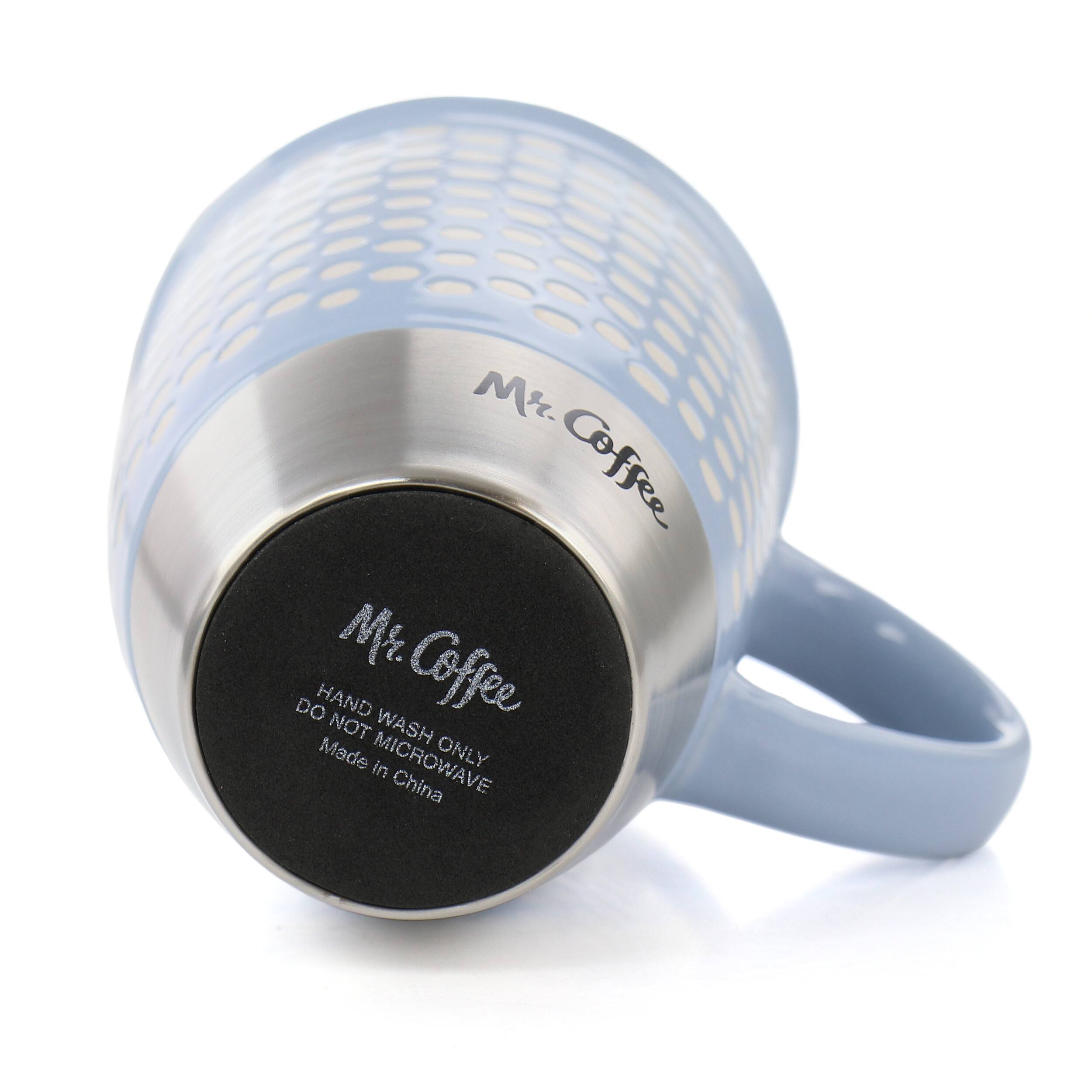 Mr. Coffee is a brand of coffee makers, and the image features a Mr. Coffee coffee cup. The cup is made in China and has a black lid. The cup is designed to be used with a Mr. Coffee coffee maker, and it is not meant to be washed by hand. It is intended for use with a microwave only.