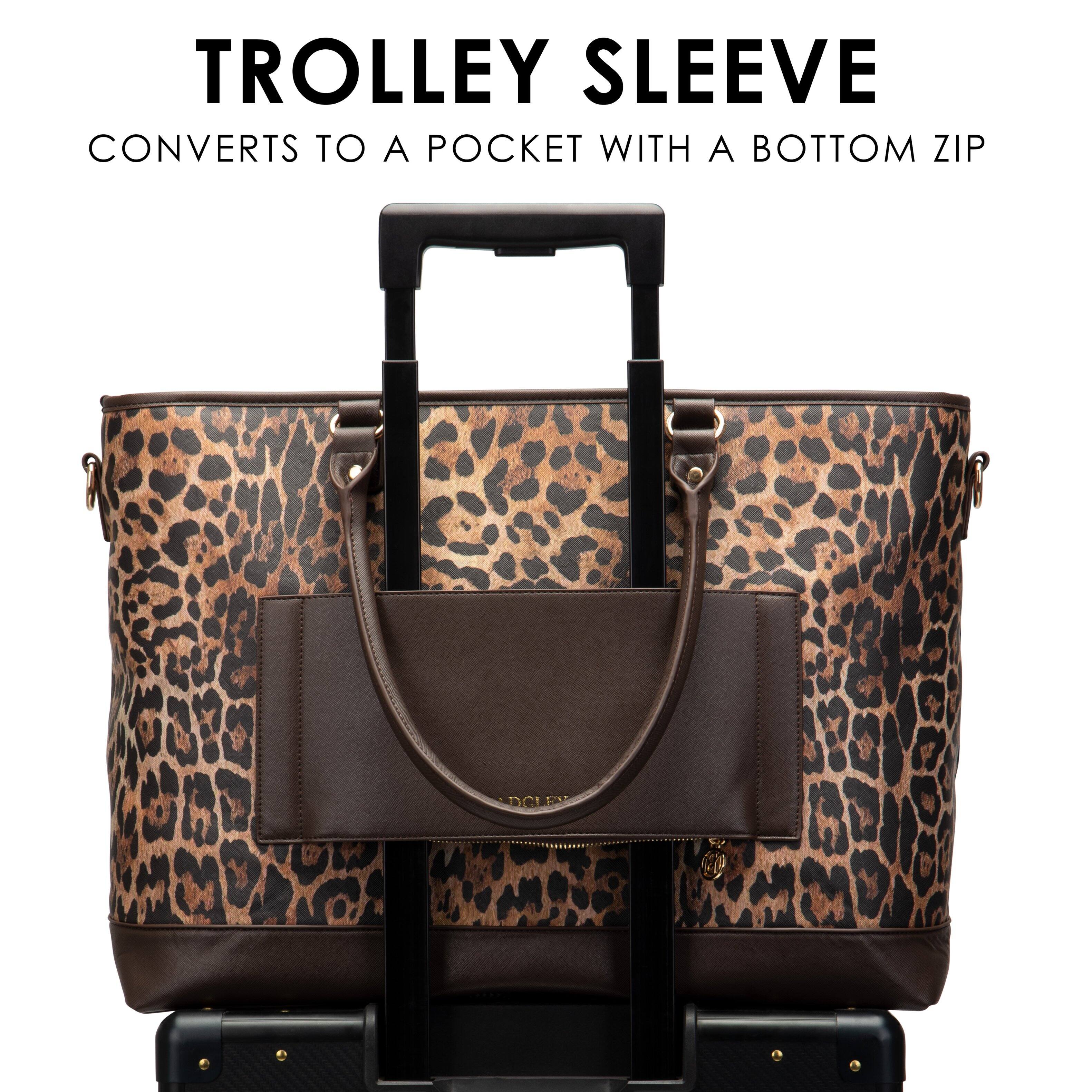 TROLLEY SLEEVE  
CONVERTS TO A POCKET WITH A BOTTOM ZIP