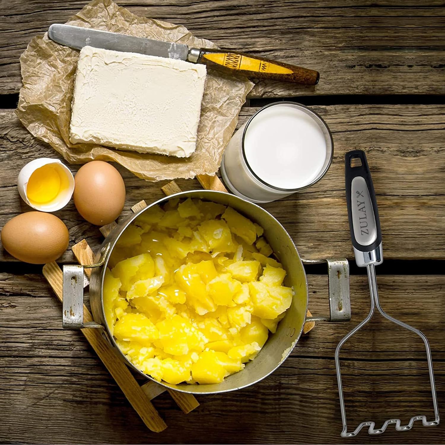 The text on the image is:

- "ZULAY" (on the spatula handle)
- "ZULAY" (on the knife handle)