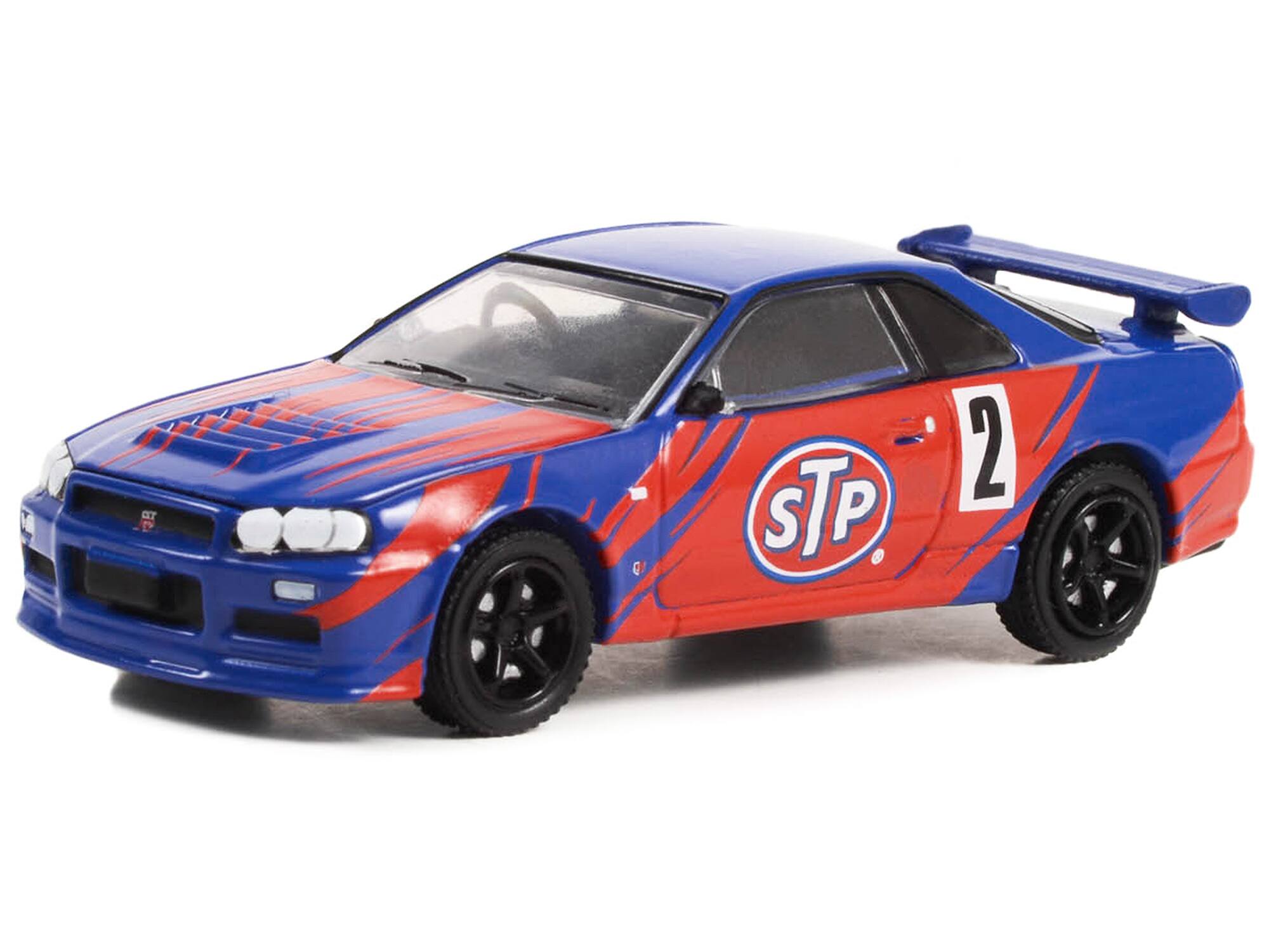 Alt View 1. Greenlight - 2002 Nissan Skyline GT-R (R34) #2 Blue with Red Graphics "STP" "Running on Empty" Series 15 1/64 Model Car by Greenlight.