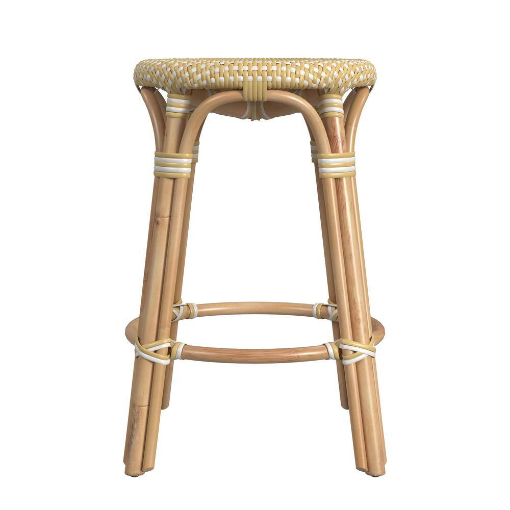 Left. Butler Specialty - Tobias Rattan Round 24" Counter Stool - Yellow And White Dot.