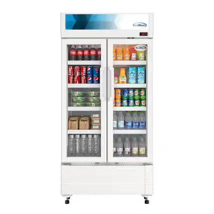 The image features a refrigerator with a variety of drinks inside. The drinks include several bottles of Coke, as well as a few bottles of Vitamin Water. The refrigerator is stocked with a diverse selection of beverages, making it an appealing option for those looking to quench their thirst.