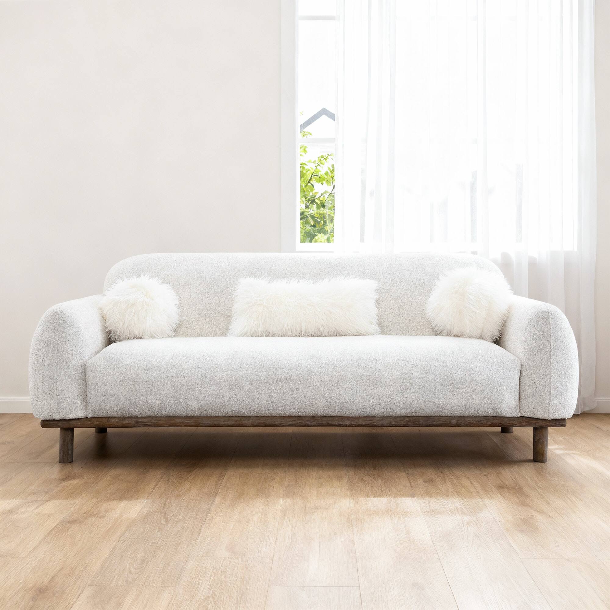Left. Vaczon - Cozy Bench-Style Sofa with Soft Cushioning and Plush Accent Pillows, Ideal for Family Room or Lounge - Oat.