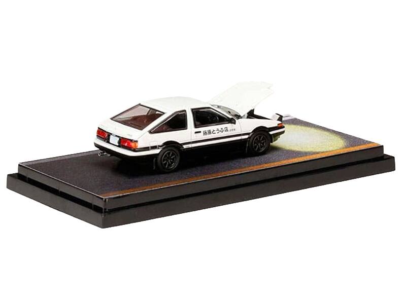 Angle. Hobby Japan - Toyota Sprinter Trueno AE86 RHD White Black Engine Mounted Model vs Kyoichi Sudo Initial D 1/64 - White and Black.