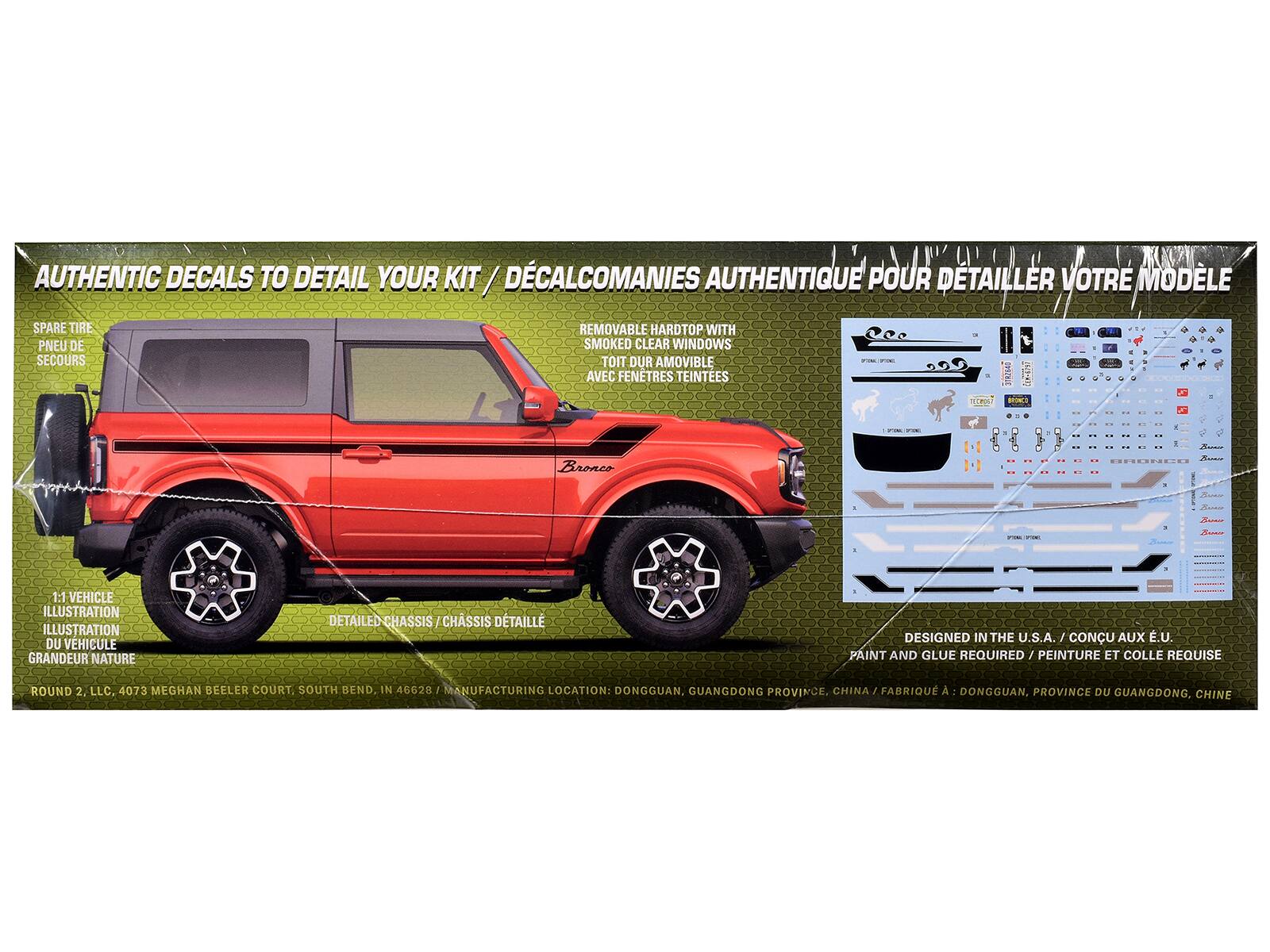 AUTHENTIC DECALS TO DETAIL YOUR KIT  
DÉCALCOMANIES AUTHENTIQUE POUR DETAILLER VOTRE MODÈLE  

SPARE TIRE  
PNEU DE SECOURS  

REMOVABLE HARDTOP WITH SMOKED CLEAR WINDOWS  
TOIT DUR AMOVIBLE AVEC FENÊTRES TEINTÉES  

1:1 VEHICLE ILLUSTRATION  
ILLUSTRATION DU VÉHICULE GRANDEUR NATURE  

DETAILED CHASSIS  
CHASSIS DÉTAILLÉ  

DESIGNED IN THE U.S.A. / CONÇU AUX É.U.  
PAINT AND GLUE REQUIRED / PEINTURE ET COLLE REQUISE  

ROUND 2, LLC. 4073 MEGHAN BEELER COURT, SOUTH BEND, IN 46628  

MANUFACTURING LOCATION: DONGGUAN, GUANGDONG PROVINCE, CHINA  
FABRIQUÉ À DONGGUAN, PROVINCE DU GUANGDONG, CHINE