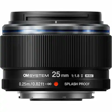 The text on the image reads: "OM System 25 mm 1:1.8 II MSC 0.25m/0.82ft-o 0.25m / 0.82ft Splash Proof."