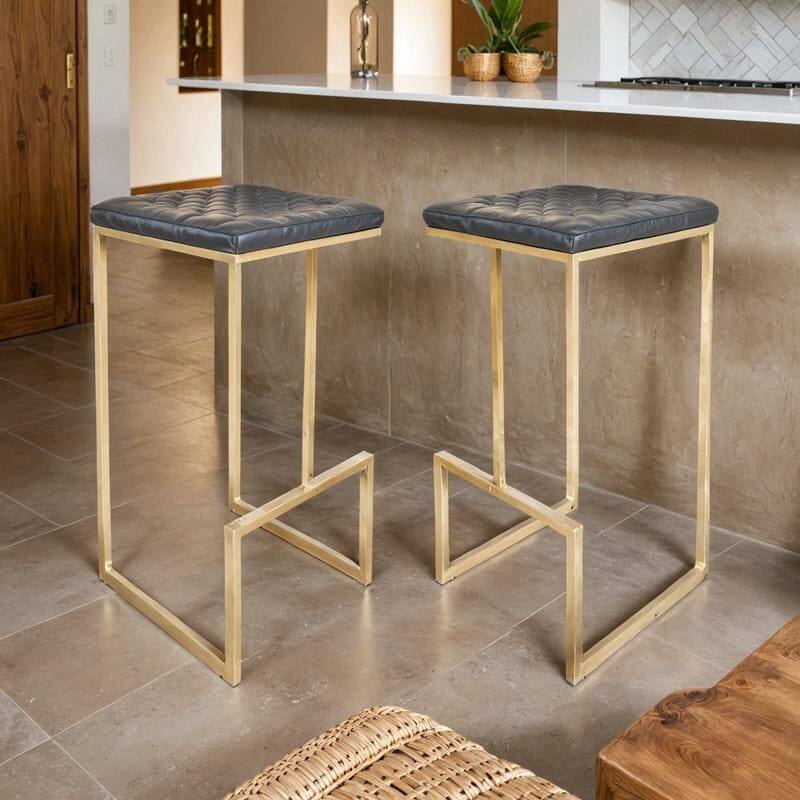 Angle. LeisureMod - Quincy Modern Quilted Leather Bar Stool with Gold Metal Frame Counter Height Chair Set of 2 - Grey.