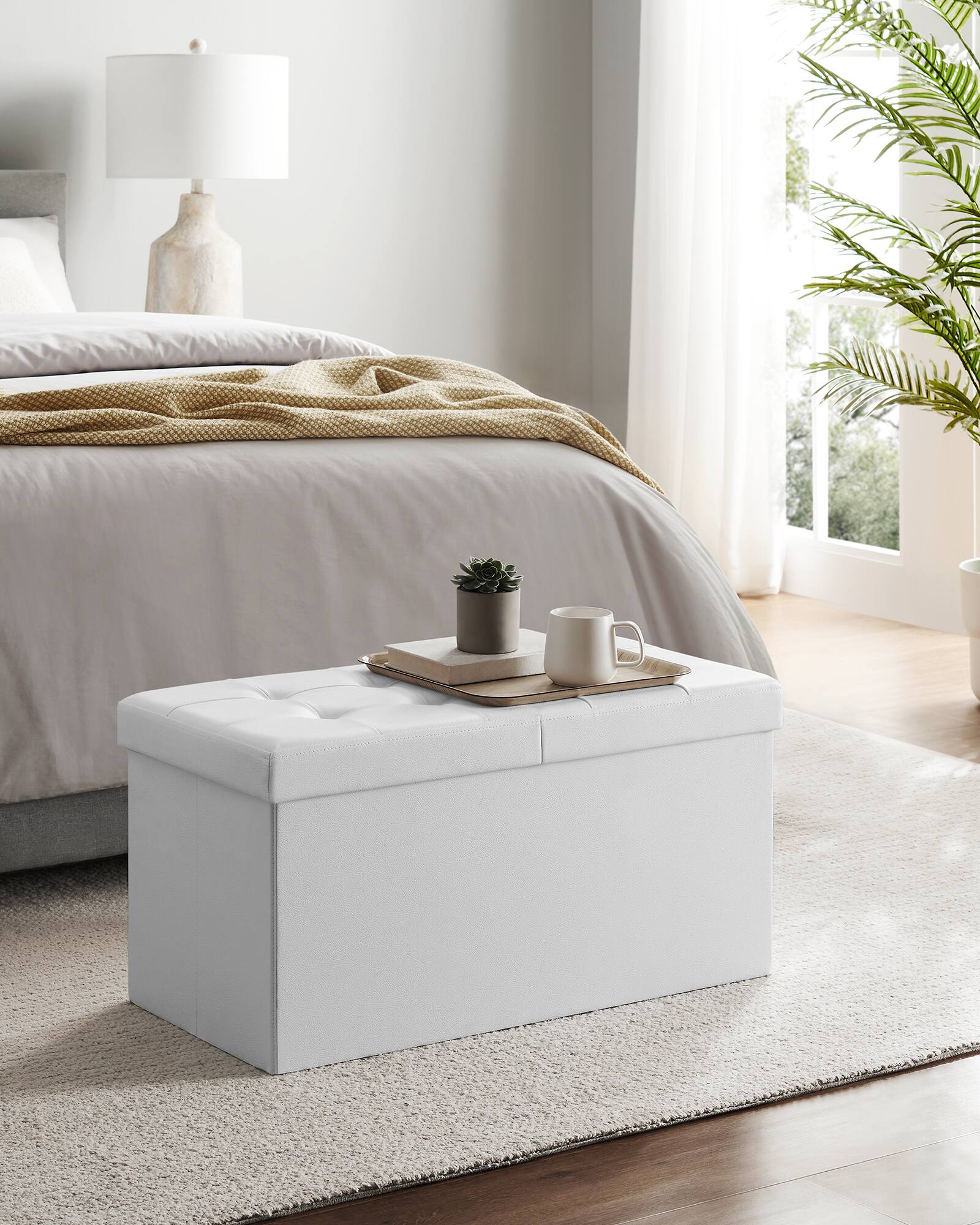 Left. Songmics Home - 30 Inches Folding Storage Ottoman Bench with Flipping Lid, Storage Chest Footstool, Faux Leather - White.