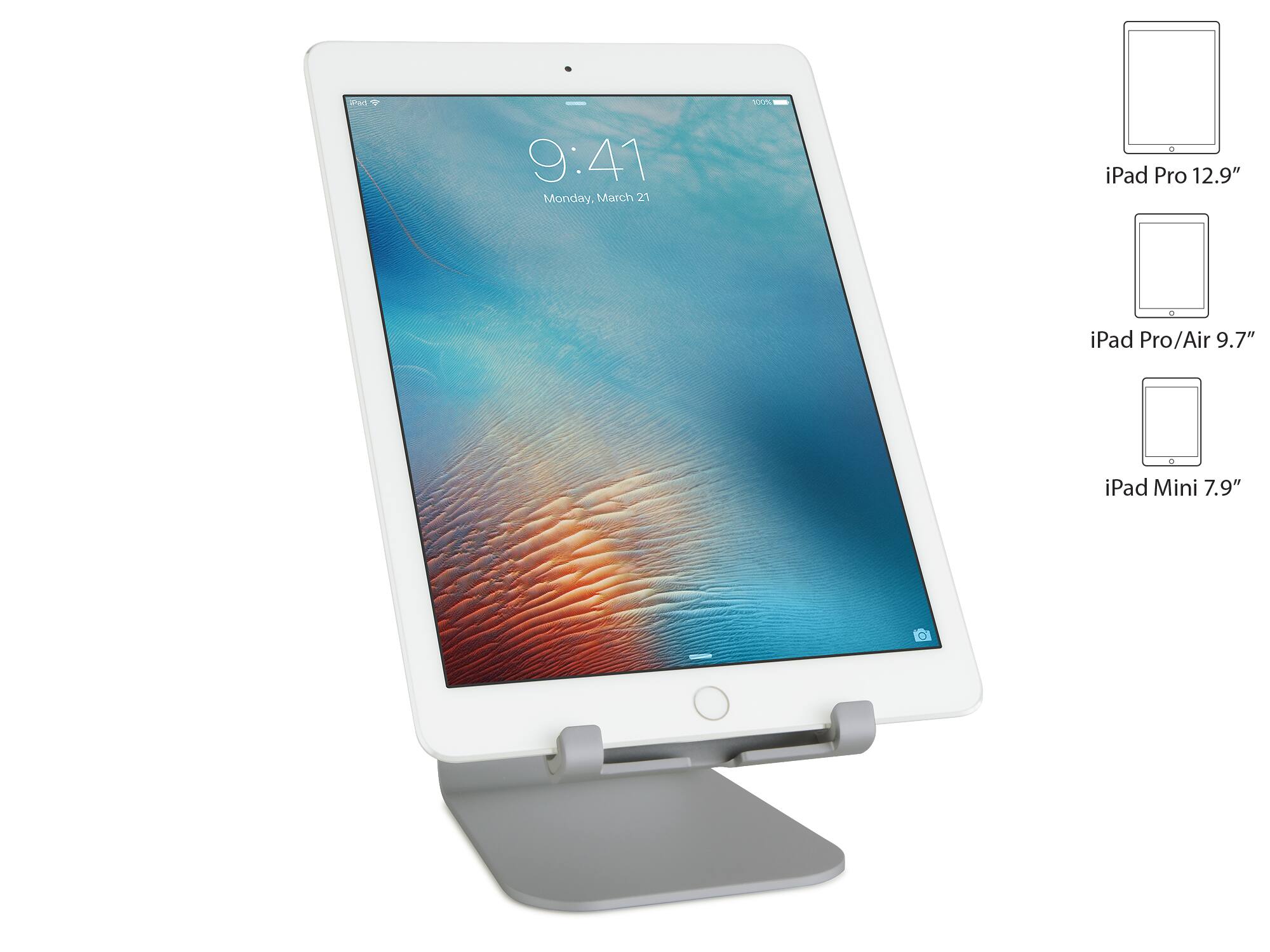 The image features a white iPad Pro with a 12.9" screen, which is placed on a stand. The stand is designed to hold the iPad at an optimal viewing angle, making it convenient for the user. The image also shows a comparison of the iPad Pro with other iPad models, including the iPad Pro/Air 9.7" and the iPad Mini 7.9". The iPad Pro is the largest of the three, with a screen size of 12.9".