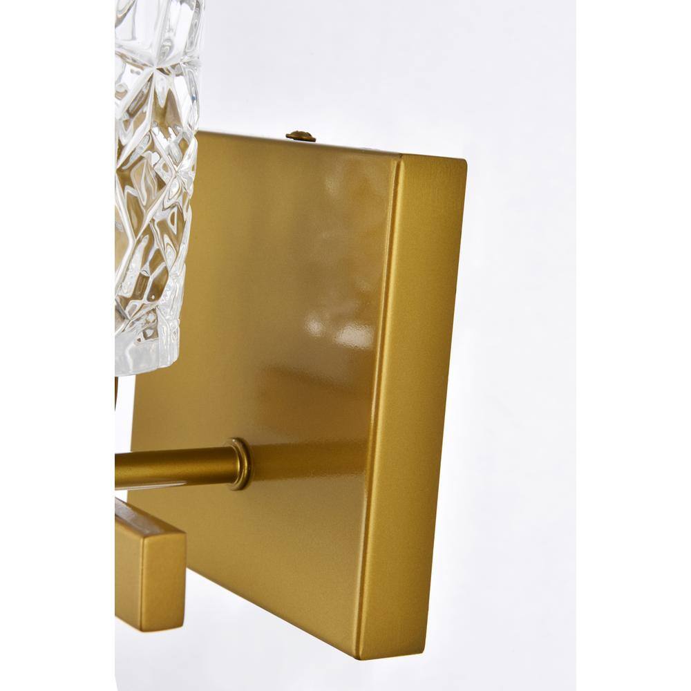 Back. Living District - Cassie 1 light bath sconce in brass with clear shade - Brass And Clear Shade.