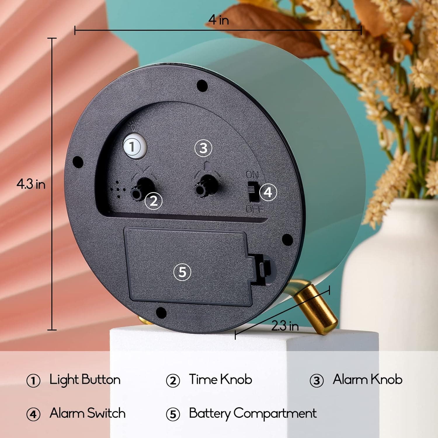 1. Light Button  
2. Time Knob  
3. Alarm Knob  
4. Alarm Switch  
5. Battery Compartment  

- 4 in  
- 4.3 in  
- 2.3 in