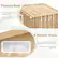 The image features a wooden structure with a pitched roof, which has grooves to prevent water accumulation and a sloped roof to reduce stress areas. The structure also has four shutter vents to promote the exchange of fresh air and the removal of stale air, keeping a dry environment for the items stored inside.