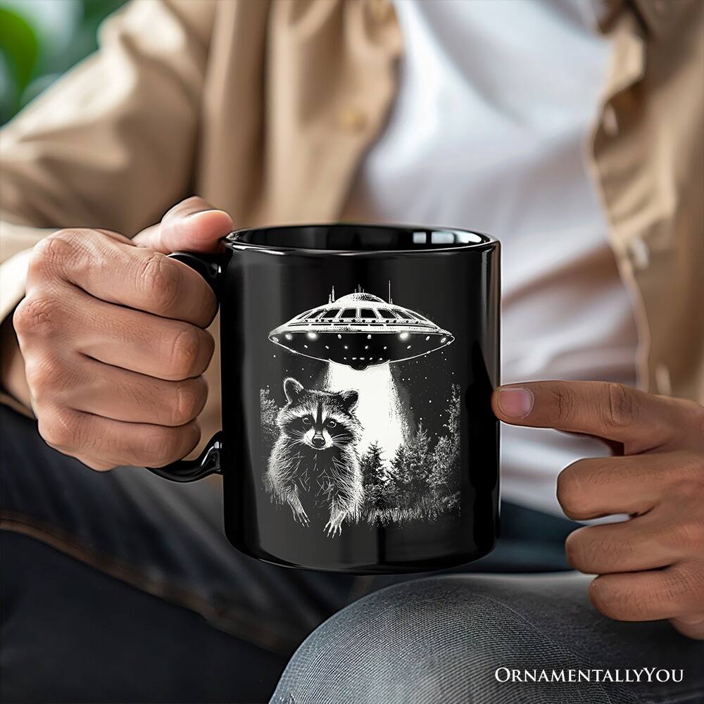Left. OrnamentallyYou - Funny UFO Raccoon Mug, Alien Gift - Black.