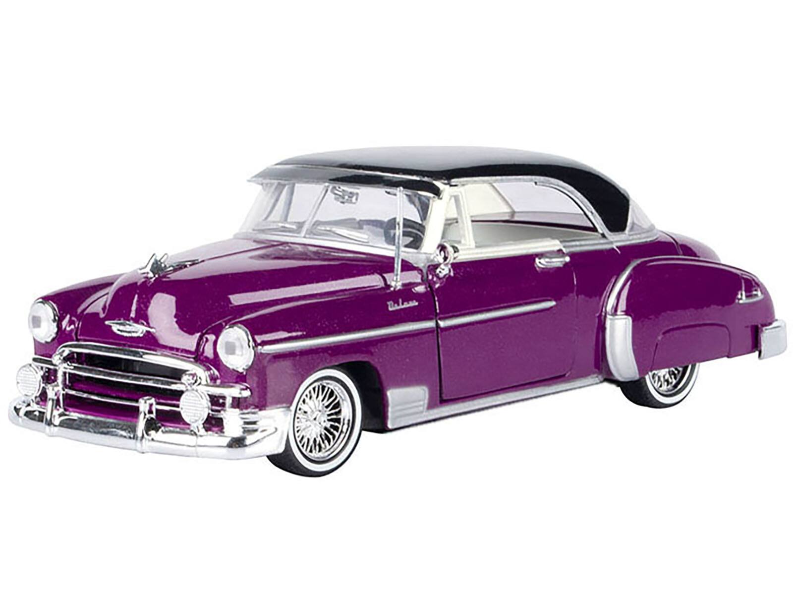 Alt View 1. Motormax - 1950 Chevrolet Bel Air Lowrider Purple Metallic w/Black Top & White Interior "Get Low" Series 1/24 Model Car by Motormax.