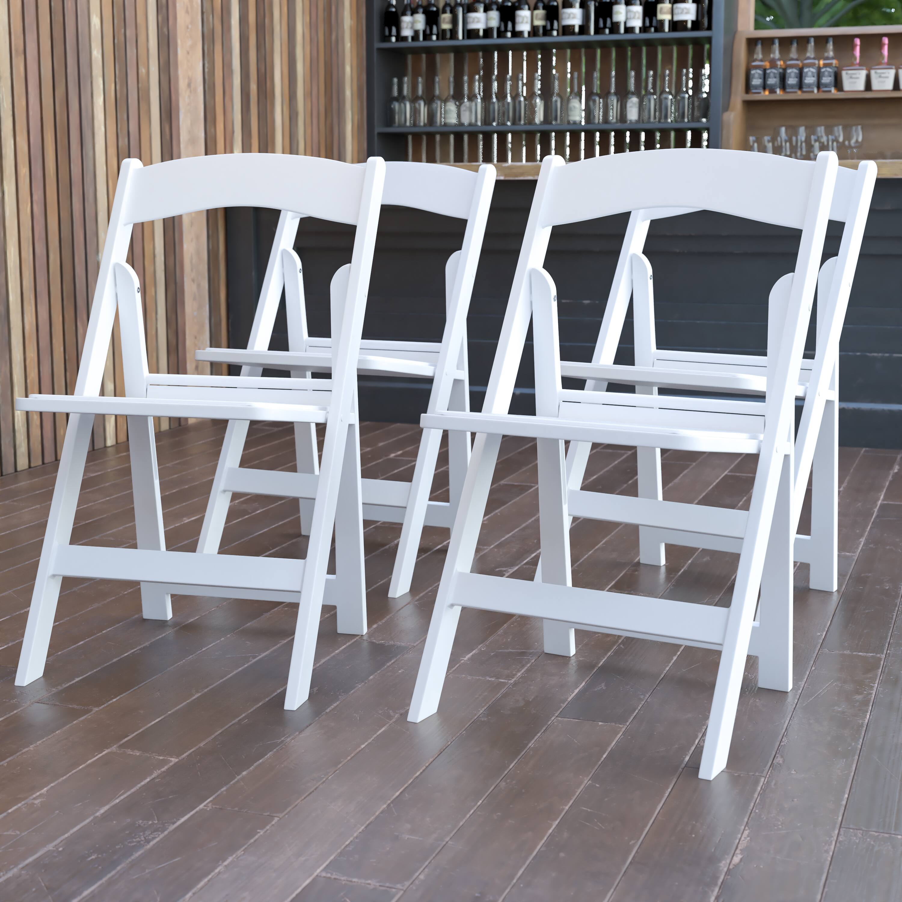 Alt View 2. Emma + Oliver - Set of 4 800 lb Weight Capacity Indoor/Outdoor Resin Folding Chairs - White.
