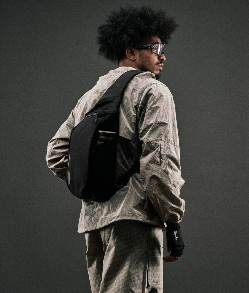 Angle. ALPAKA - Metro Crossbody Right Shoulder Sling Bag Men,Sling Backpack - Fits 11" Tablet - Single Shoulder - Black Axoflux 210D.