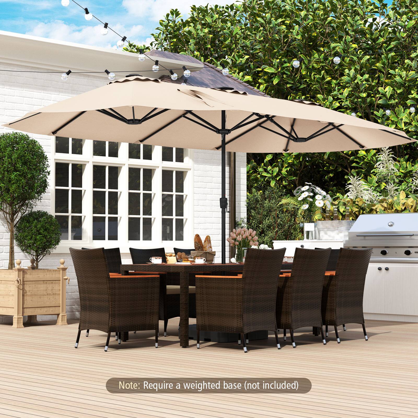 The image features a large outdoor patio set with a dining table and chairs. The table is surrounded by chairs, and there is an umbrella above it. The patio set is placed on a wooden deck. The table is set for a meal, with a vase and a potted plant nearby. The umbrella provides shade for the dining area. The chairs are arranged around the table, creating a comfortable and inviting atmosphere for outdoor dining.