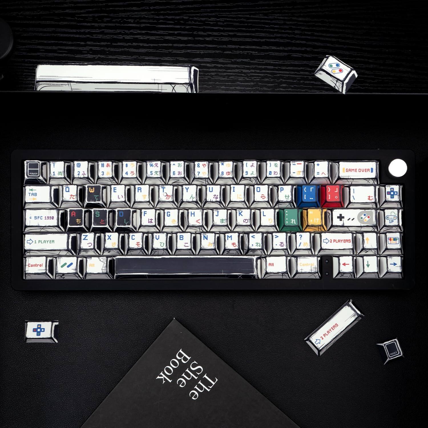 Sure, here is the corrected and grouped text from the image:

---

**Top Row:**
1. ! 2. @ 3. # 4. $ 5. % 6. ^ 7. & 8. * 9. ( 0. ) - _ = + Backspace

**Second Row:**
Q W E R T Y U I O P [ ] \ Return

**Third Row:**
A S D F G H J K L ; ' " Enter

**Fourth Row:**
Z X C V B N M , . / Shift

**Fifth Row:**
Shift Spacebar Shift

**Function Keys:**
F1 F2 F3 F4 F5 F6 F7 F8 F9 F10 F11 F12

**Special Keys:**
Ctrl Alt SFC 1990 Alt

**Game Controls:**
1 PLAYER 2 PLAYERS Control A B C D

**Game Over:**
GAME OVER

**Joystick:**
1P 2P

**Book:**
The Book of

---

This should cover all the visible text from the image.