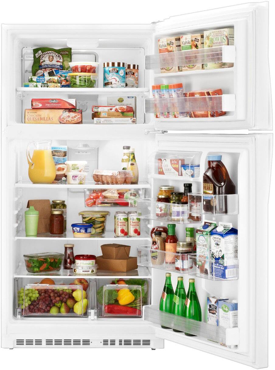 The refrigerator is fully stocked with a variety of food items. There are several bottles of drinks, including juice and soda, as well as multiple bottles of condiments such as ketchup and mustard. The refrigerator also contains a variety of fruits, including apples and oranges. Additionally, there are several bowls and a cup inside the refrigerator, likely used for storing leftovers or other food items. The refrigerator is well-organized, making it easy to find and access the desired items.
