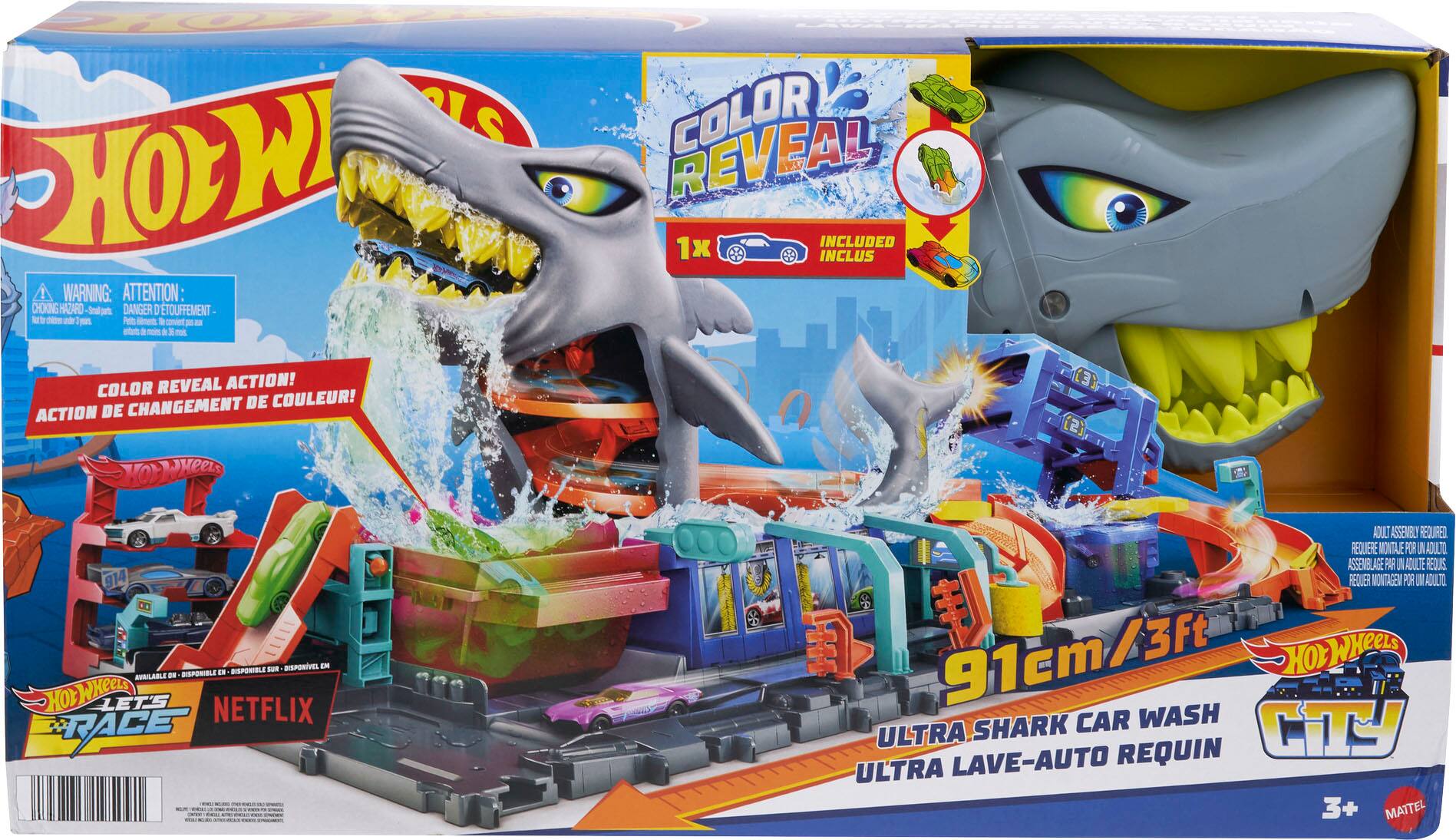 The text on the image is in Spanish, so I will provide the corrected text in English.

WARNING: ATTENTION: CHOKING HAZARD - Small Parts. Not for children under 3 years.

INCLUDED: 1x Color Reveal Action!

COLOR REVEAL INCLUDED: 1x Color Reveal Action!

CHANGEMENT DE COULEUR: ACTION DE YO-YO!

AVAILABLE: Hot Wheels LET'S RACE - OLT ASSEMBLE REQUIRED.

MONTAGEM POR IM AOULTO: 91cm/3ft.

Ultra LAVE-AUTO REQUIN: Ultra 3+ MATTEL.